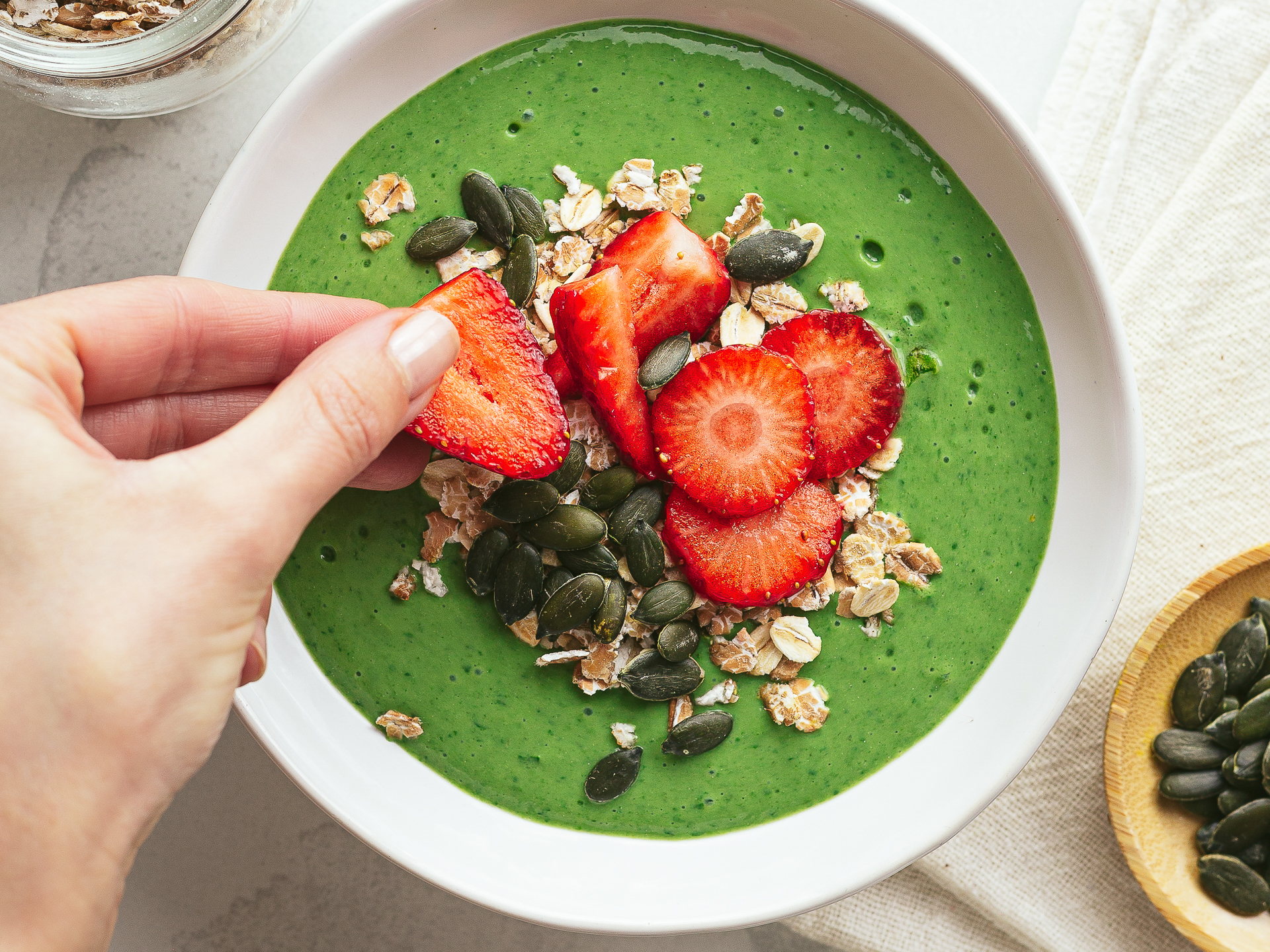 high-iron spinach smoothie bowl with strawberries