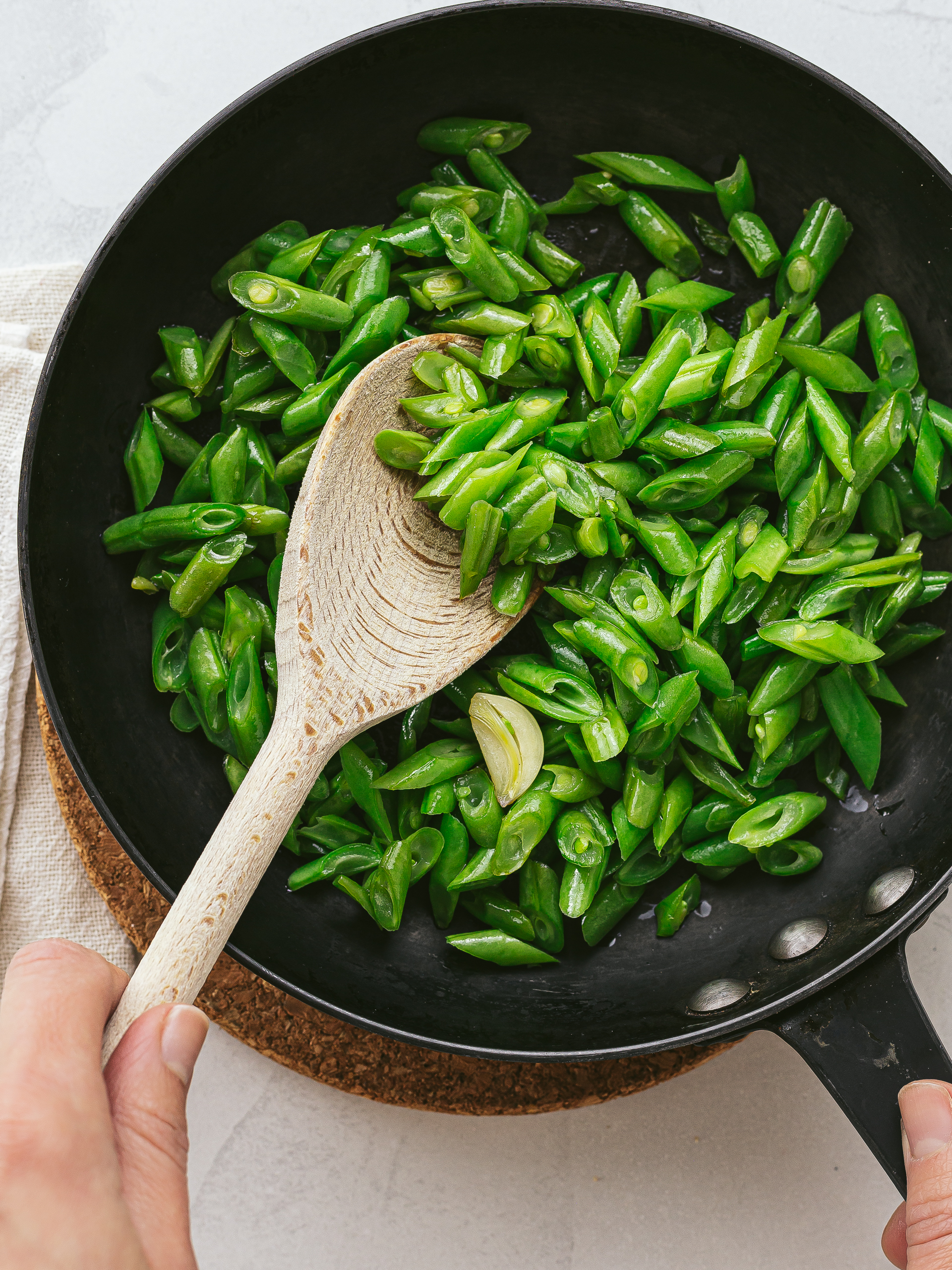 chopped green beans sautéed in a skillet with garlic