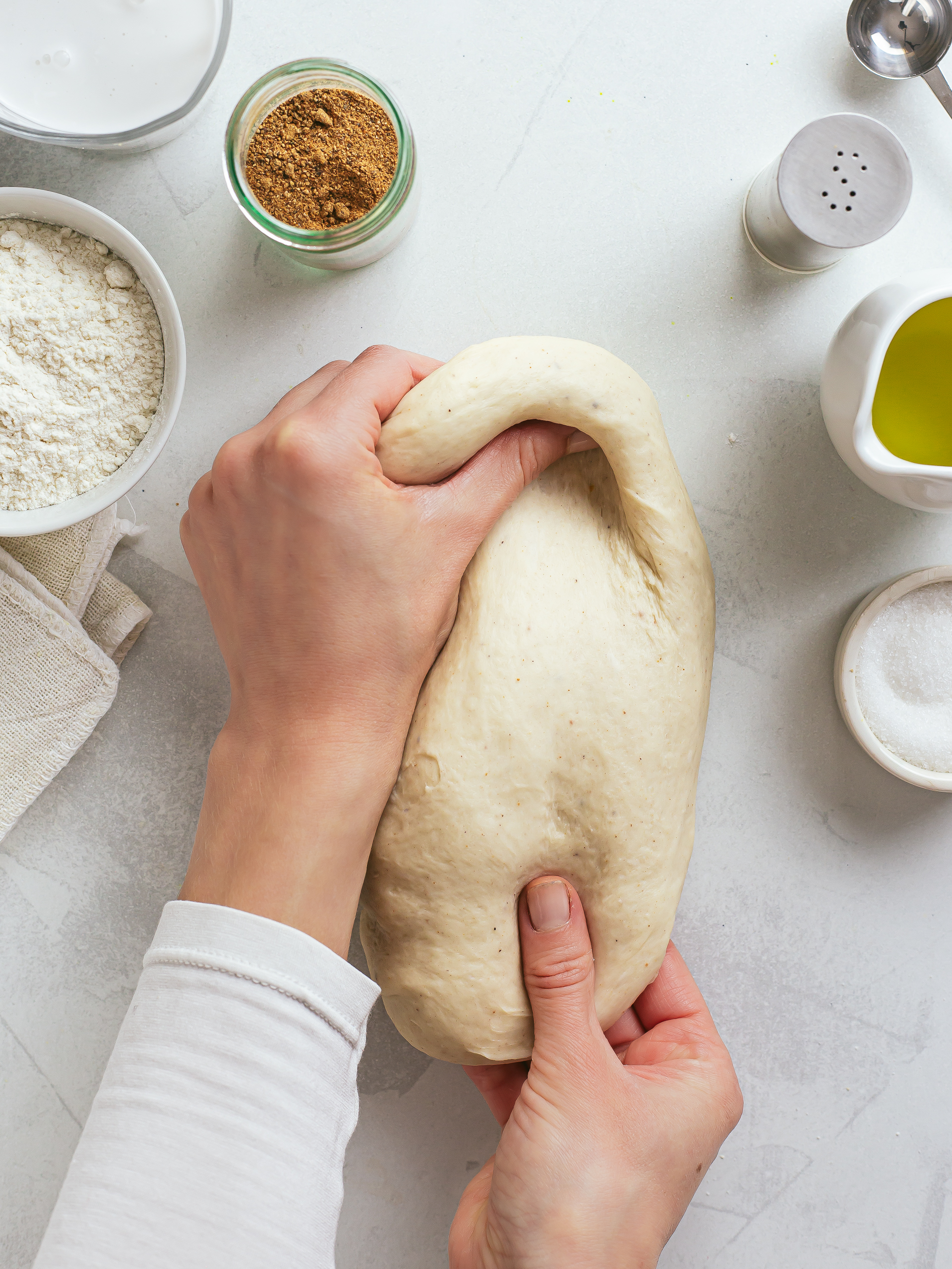 woman kneading dough for egg roll wrappers