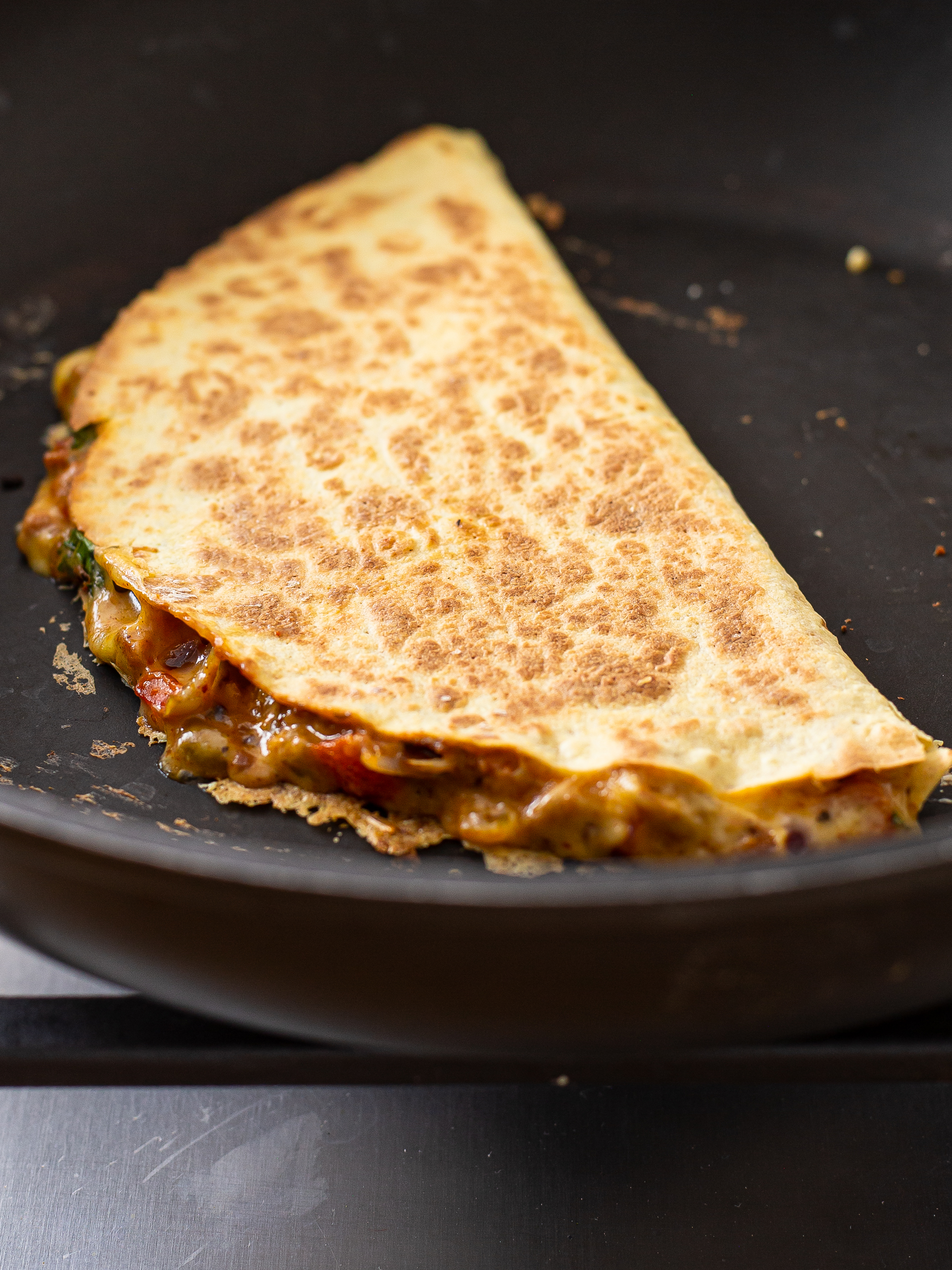 cooked quesadilla in a skillet