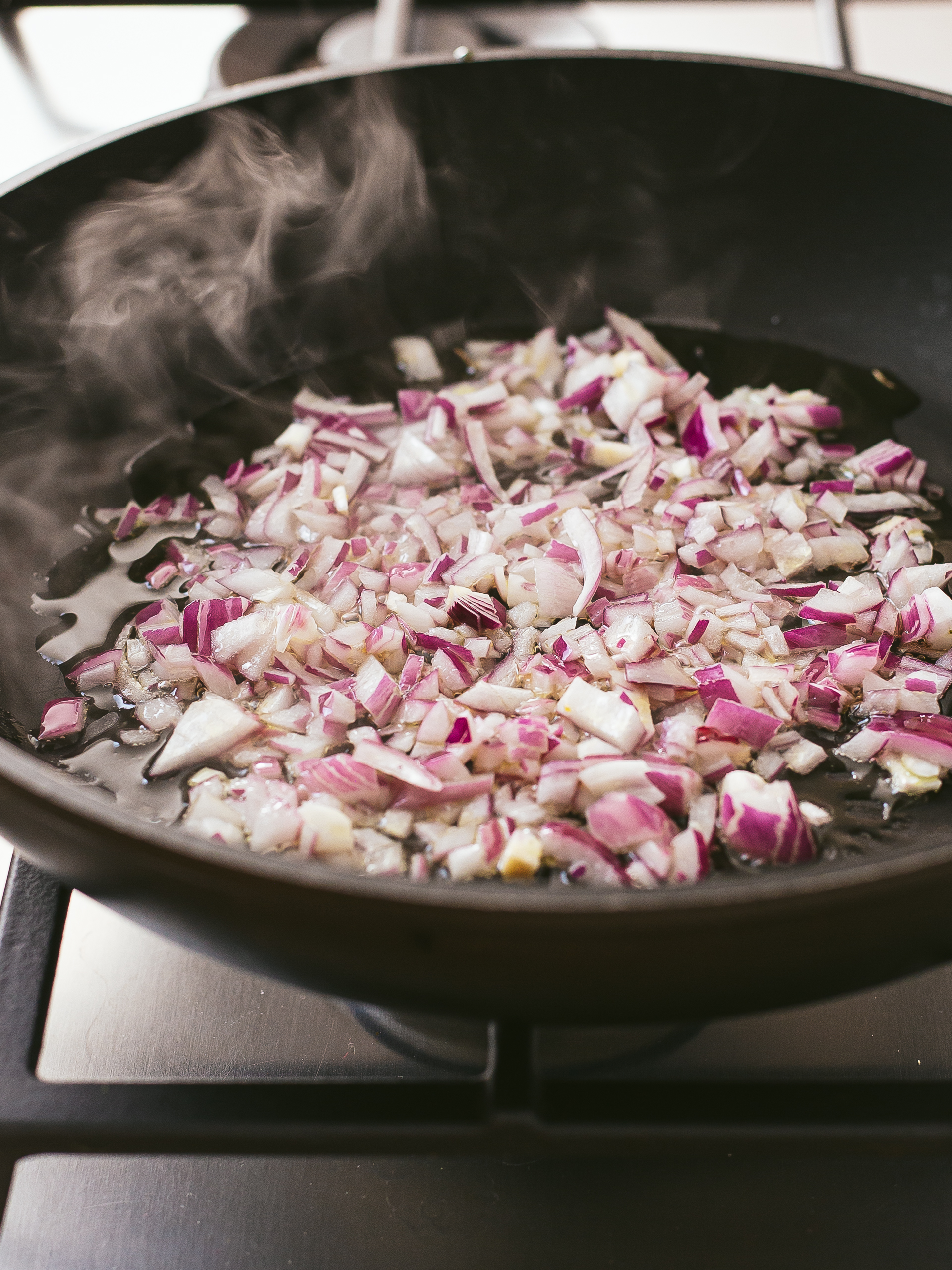 chopped red onions sauteed in a pan