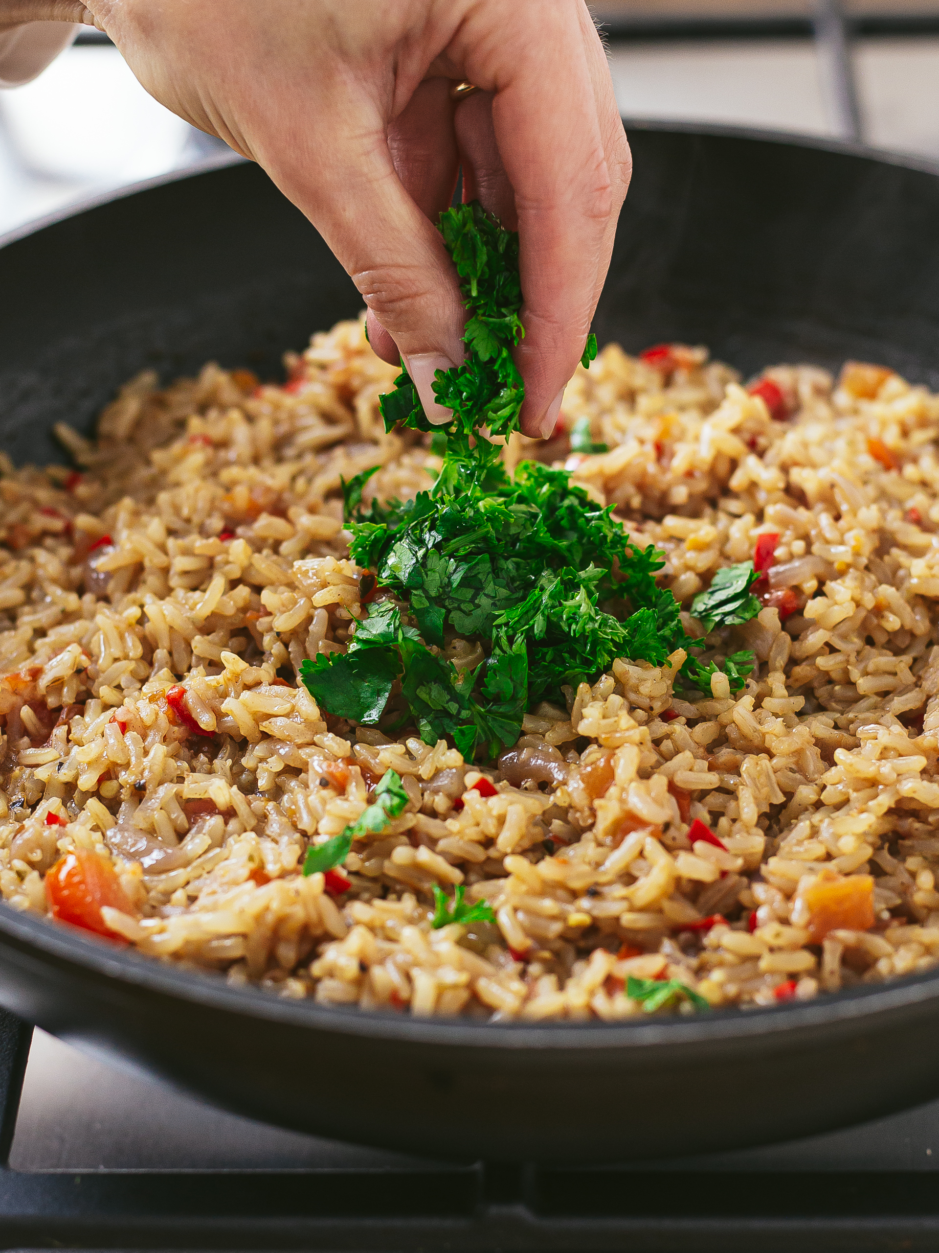 kenyan pilau topped with chopped parsley and coriander