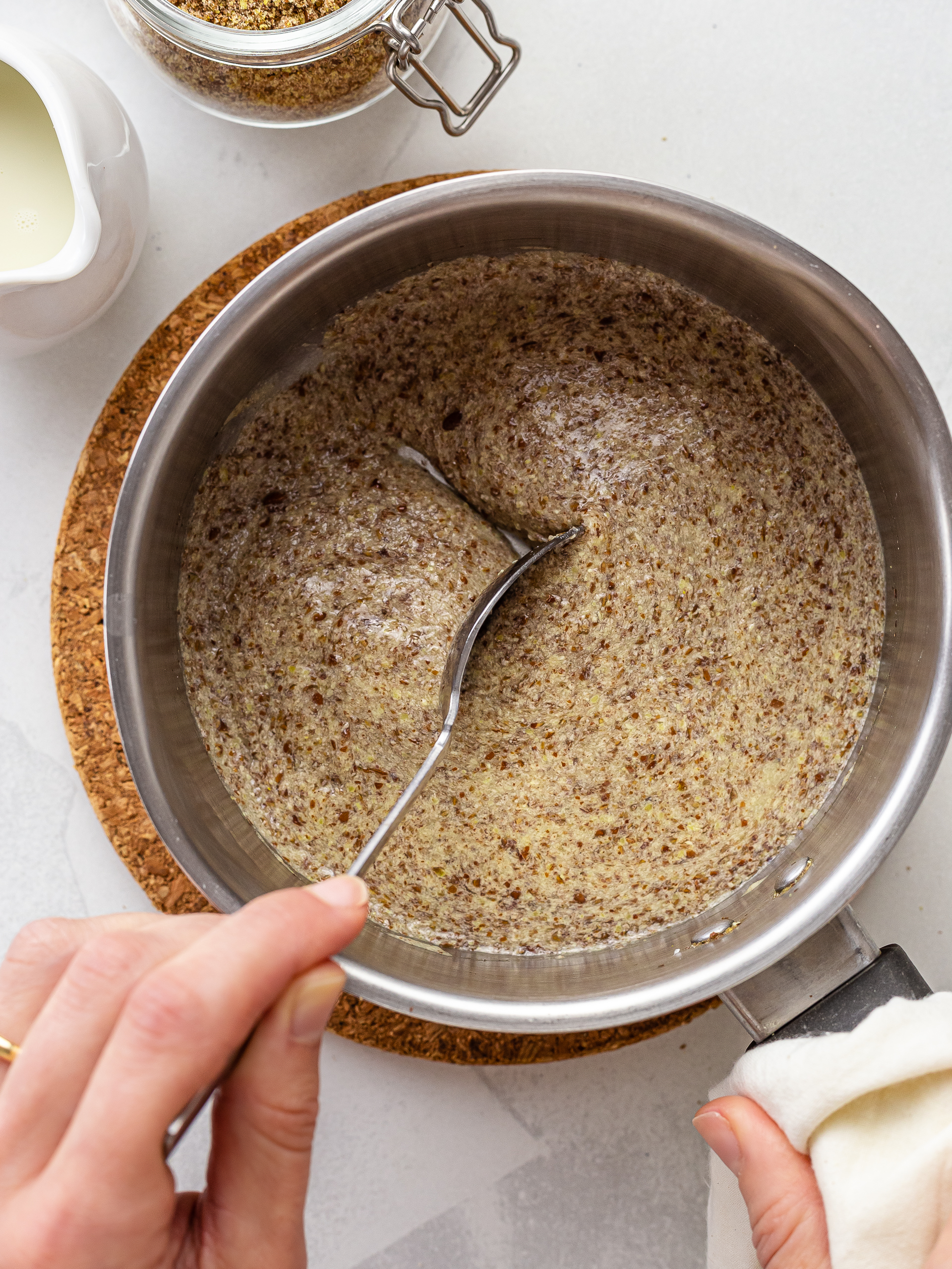 flaxseeds cooked in a pot with milk into thick porridge