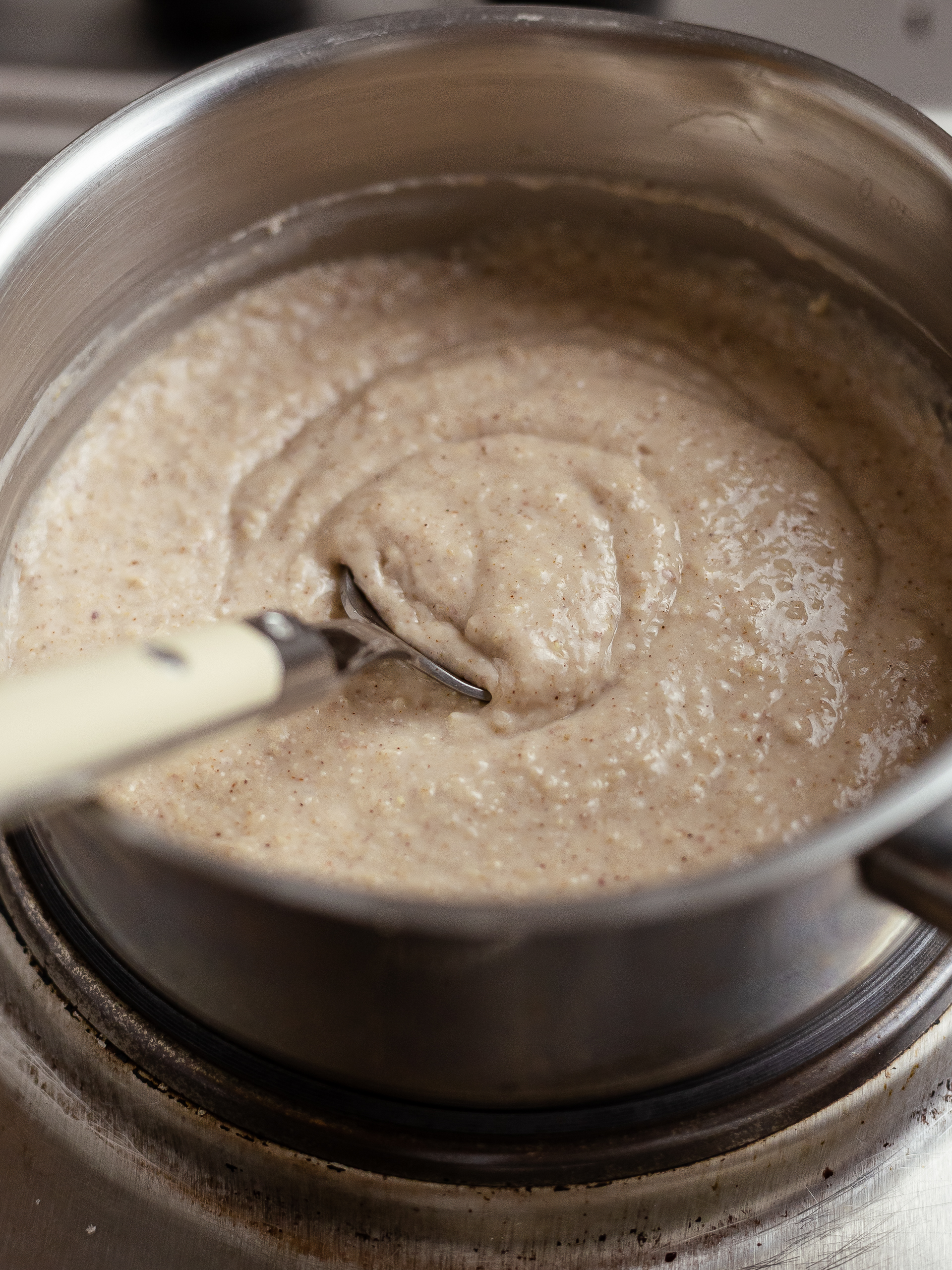 jamaican oat peanut porridge cooking in a pot