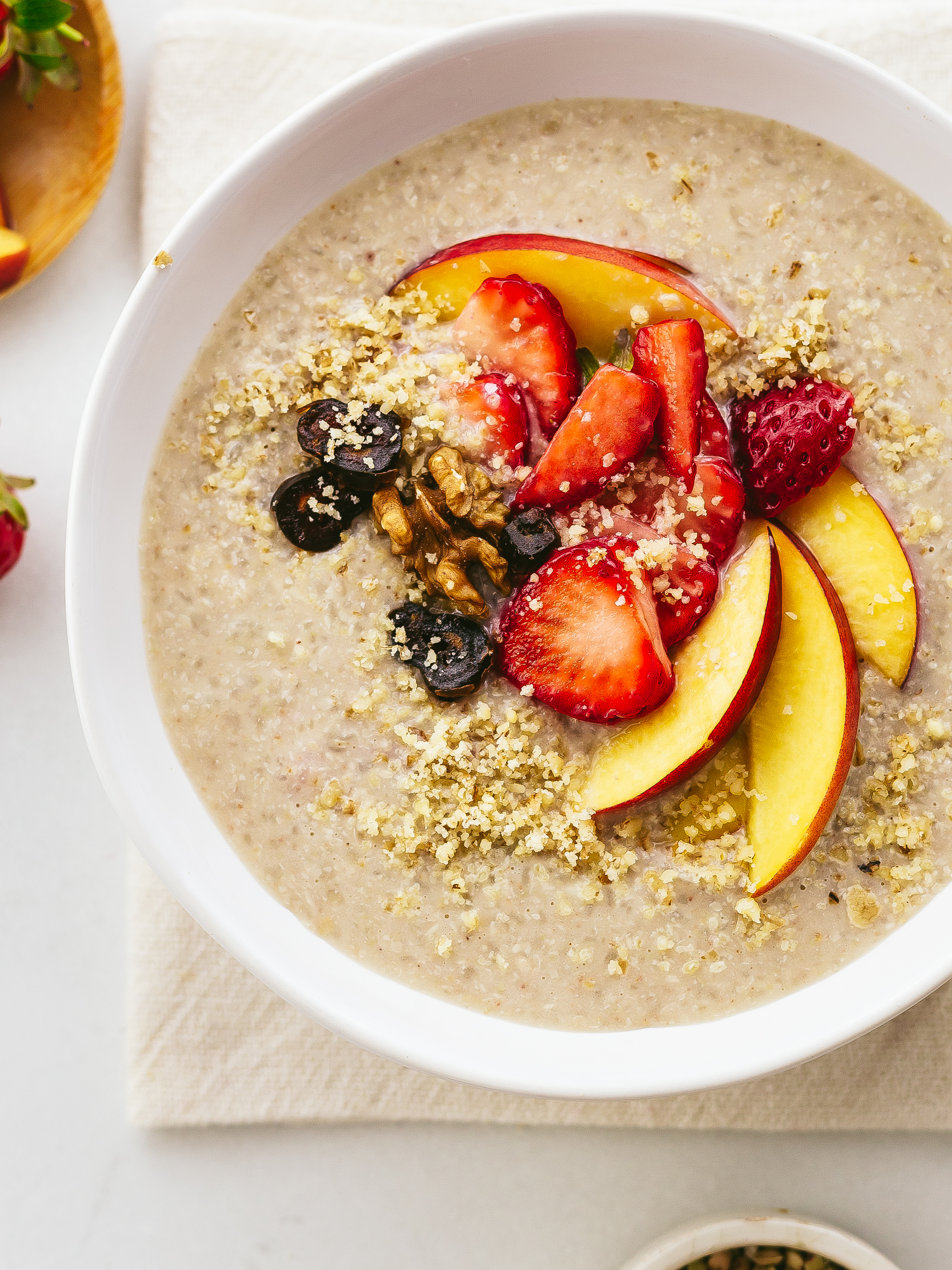 cream of buckwheat porridge with peaches, strawberries, dates and walnuts