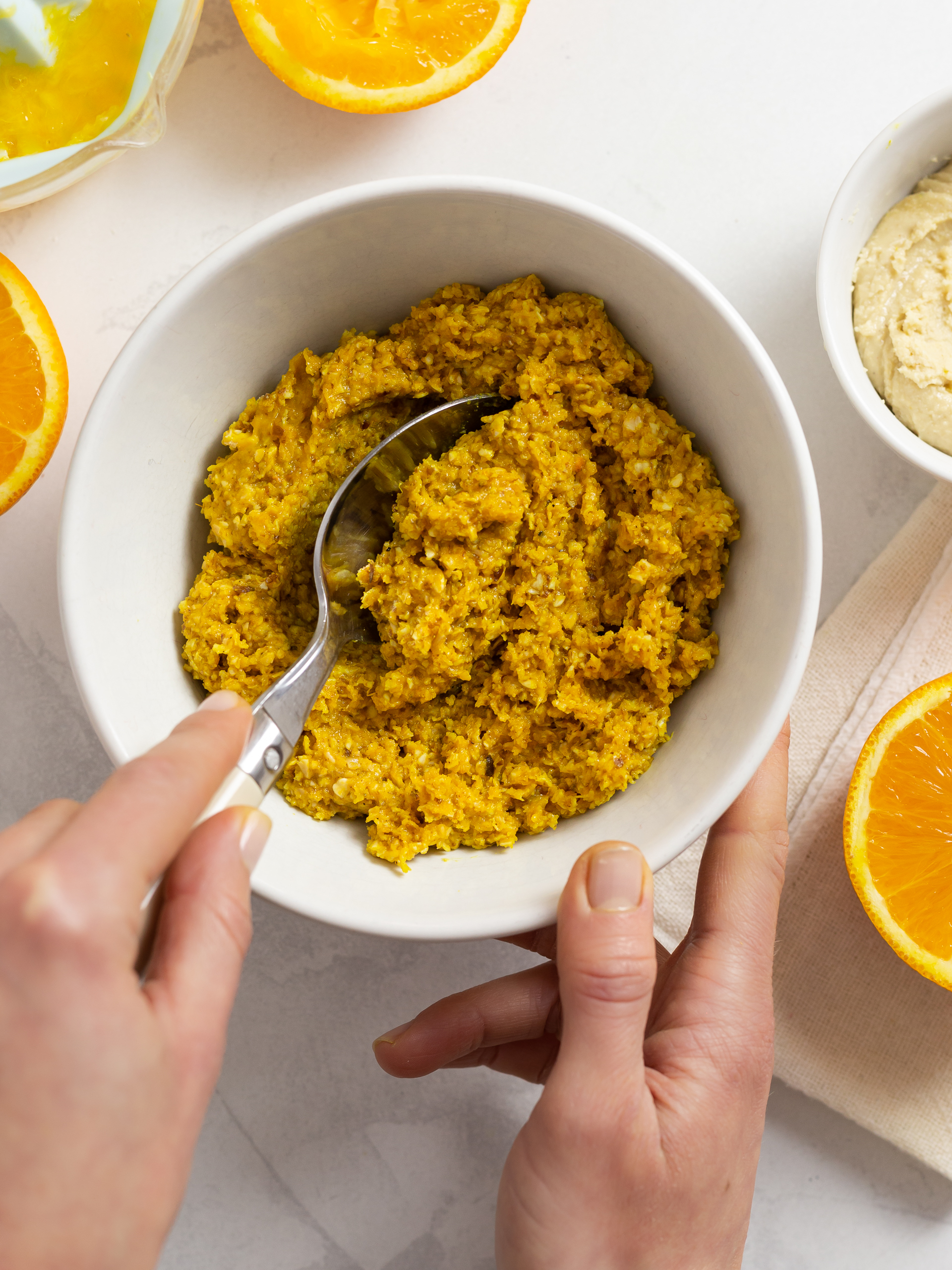 oat balls dough with turmeric, orange juice, and cashew butter