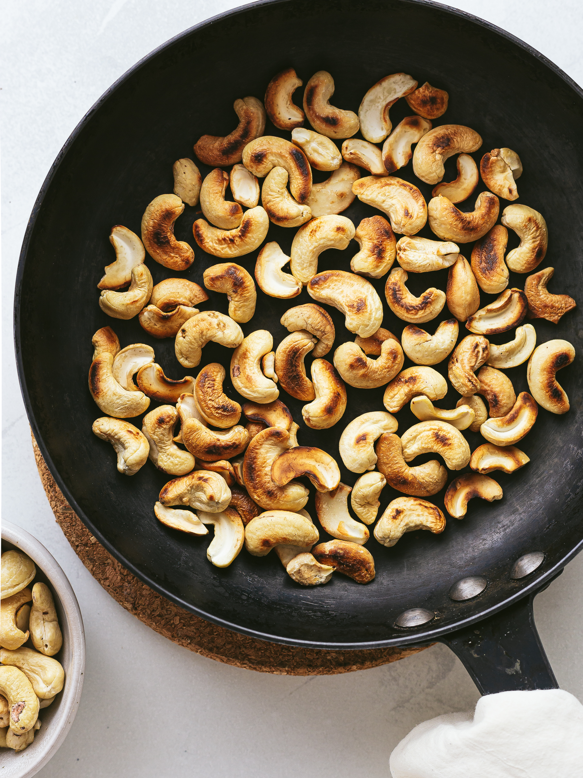 roasted cashews in a skillet