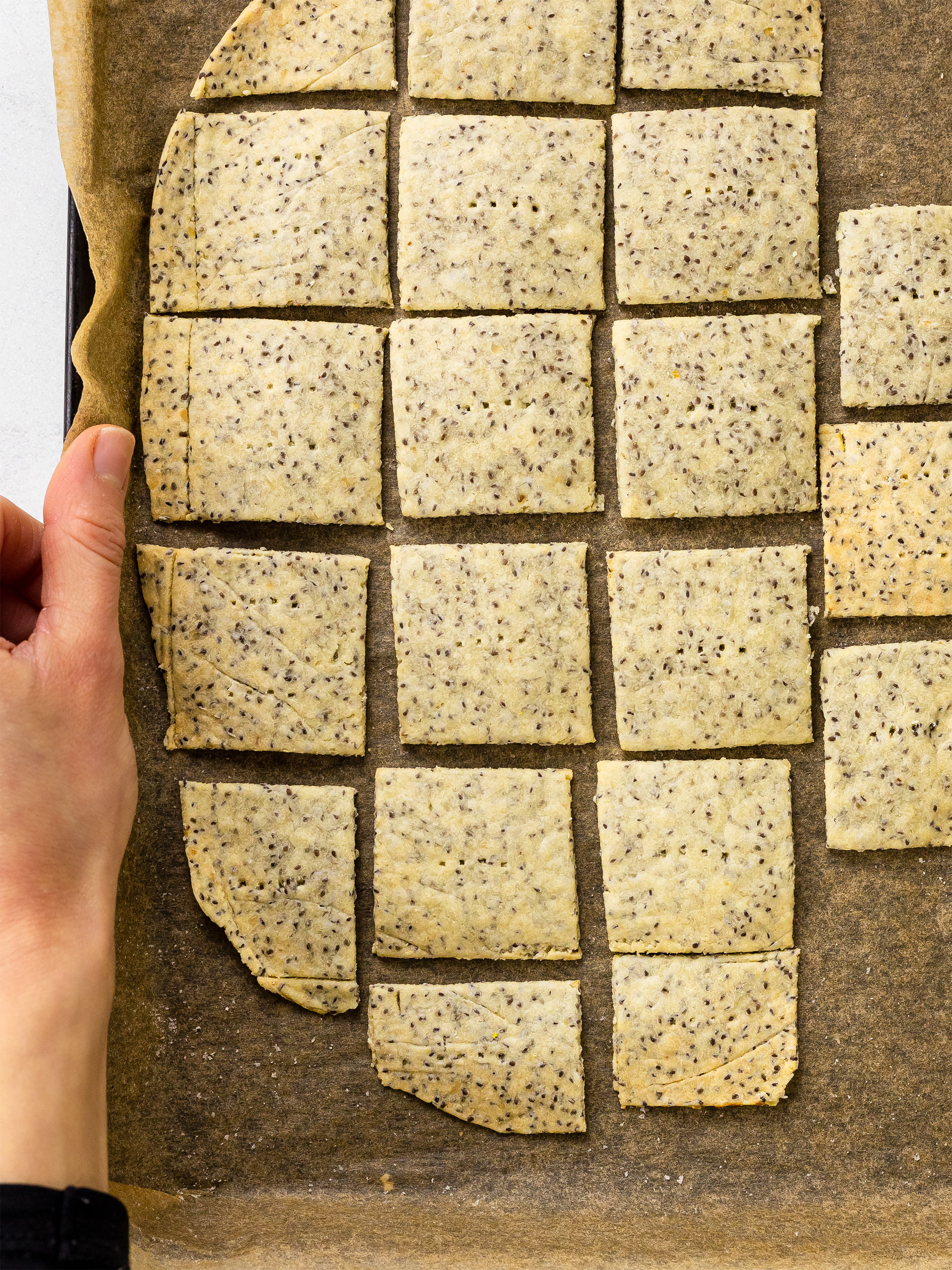 baked chia seed crackers on a tray