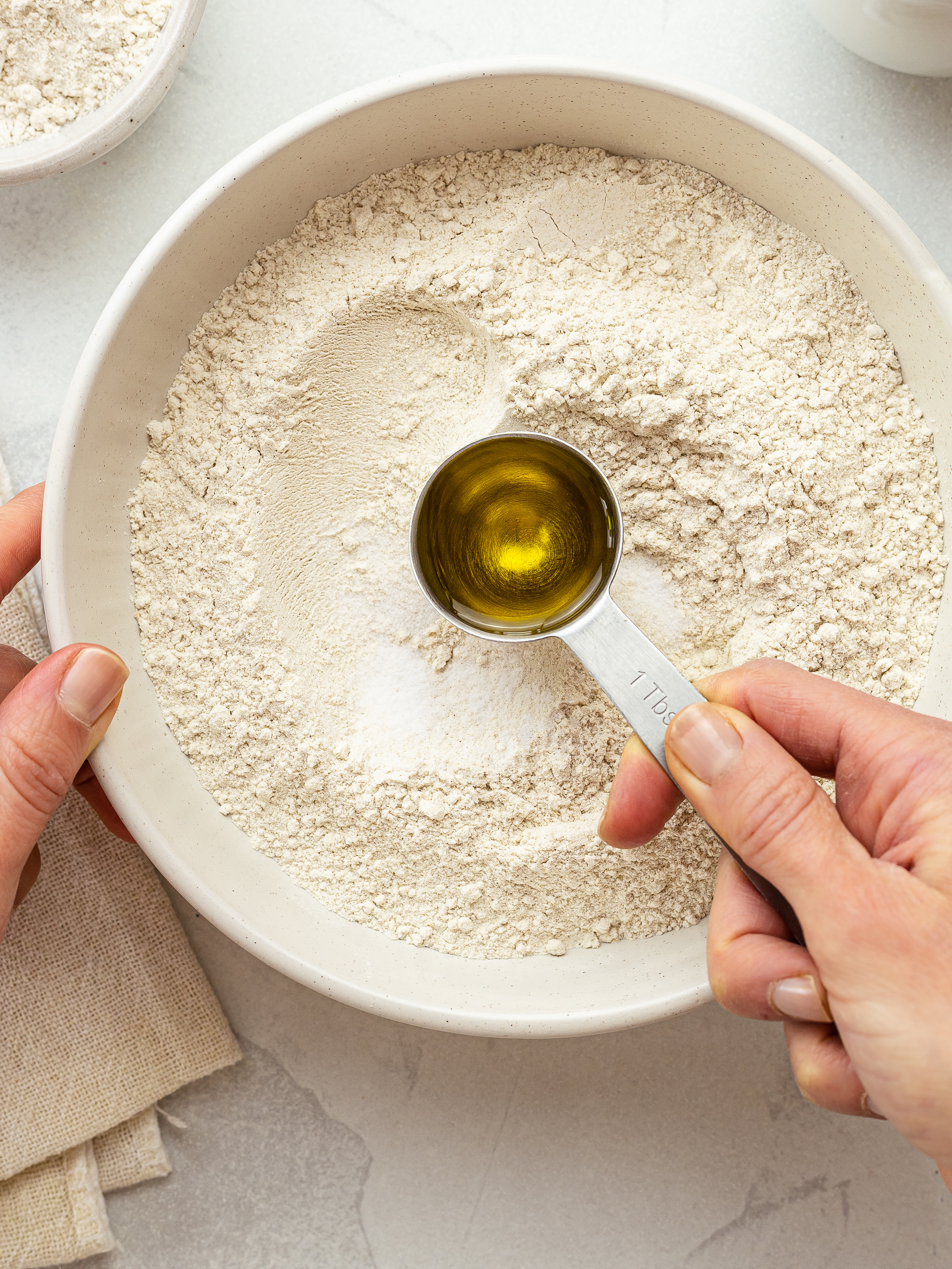 buckwheat flour with salt and oil in a bowl