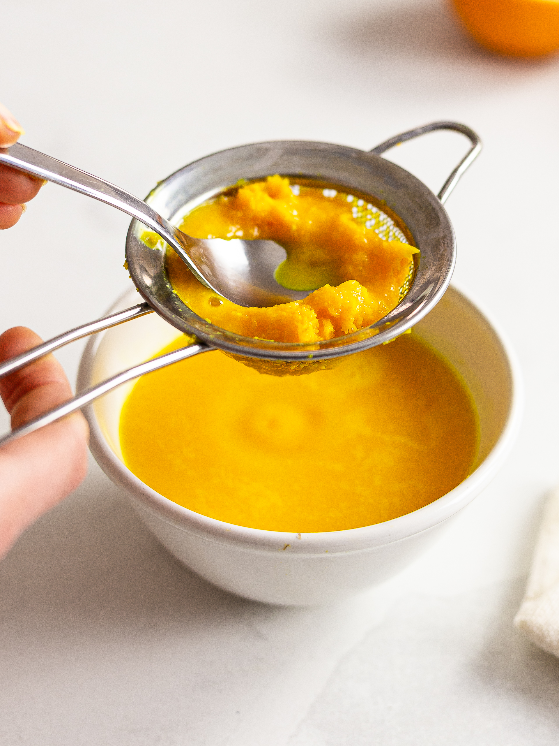 Ginger turmeric juice filtered through a strainer