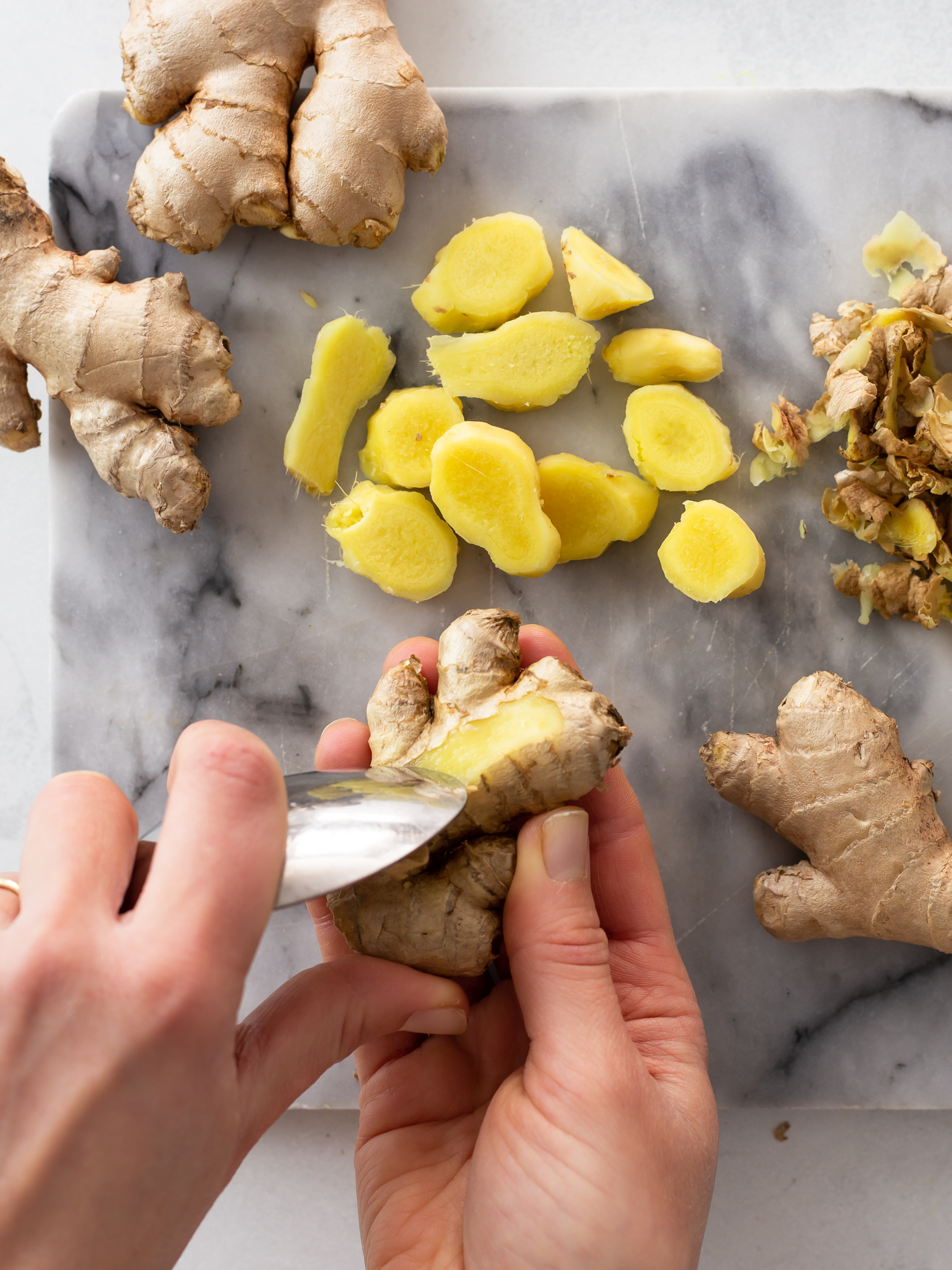 Fresh ginger root peeled with a spoon and chopped