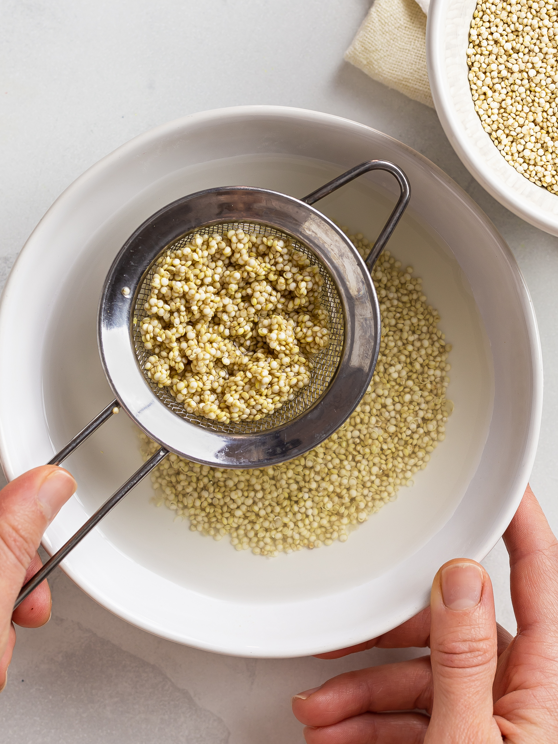 soaked and drained raw quinoa in a bowl