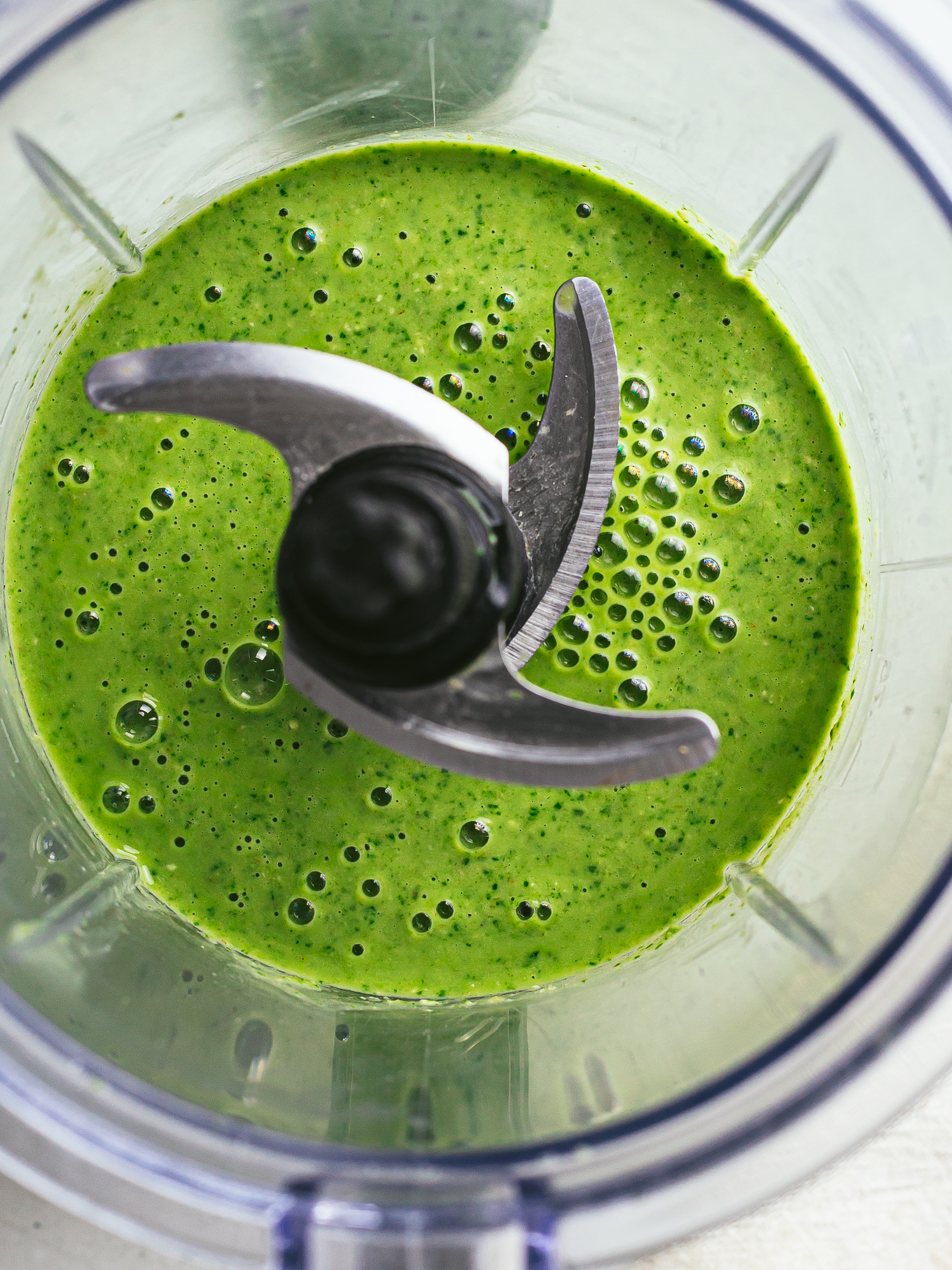 high iron green spinach smoothie in a blender