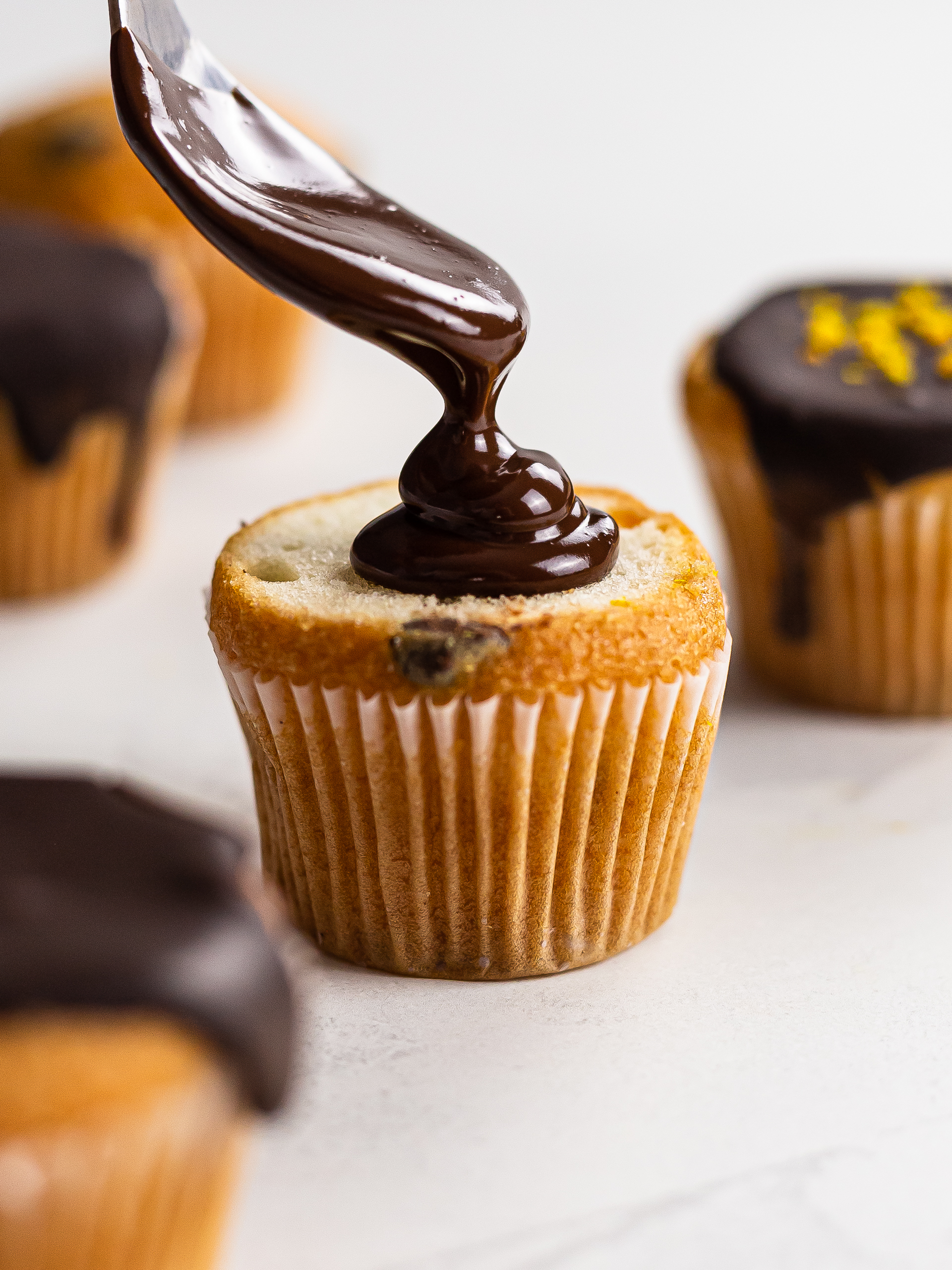 orange chocolate ganache glaze on a muffin