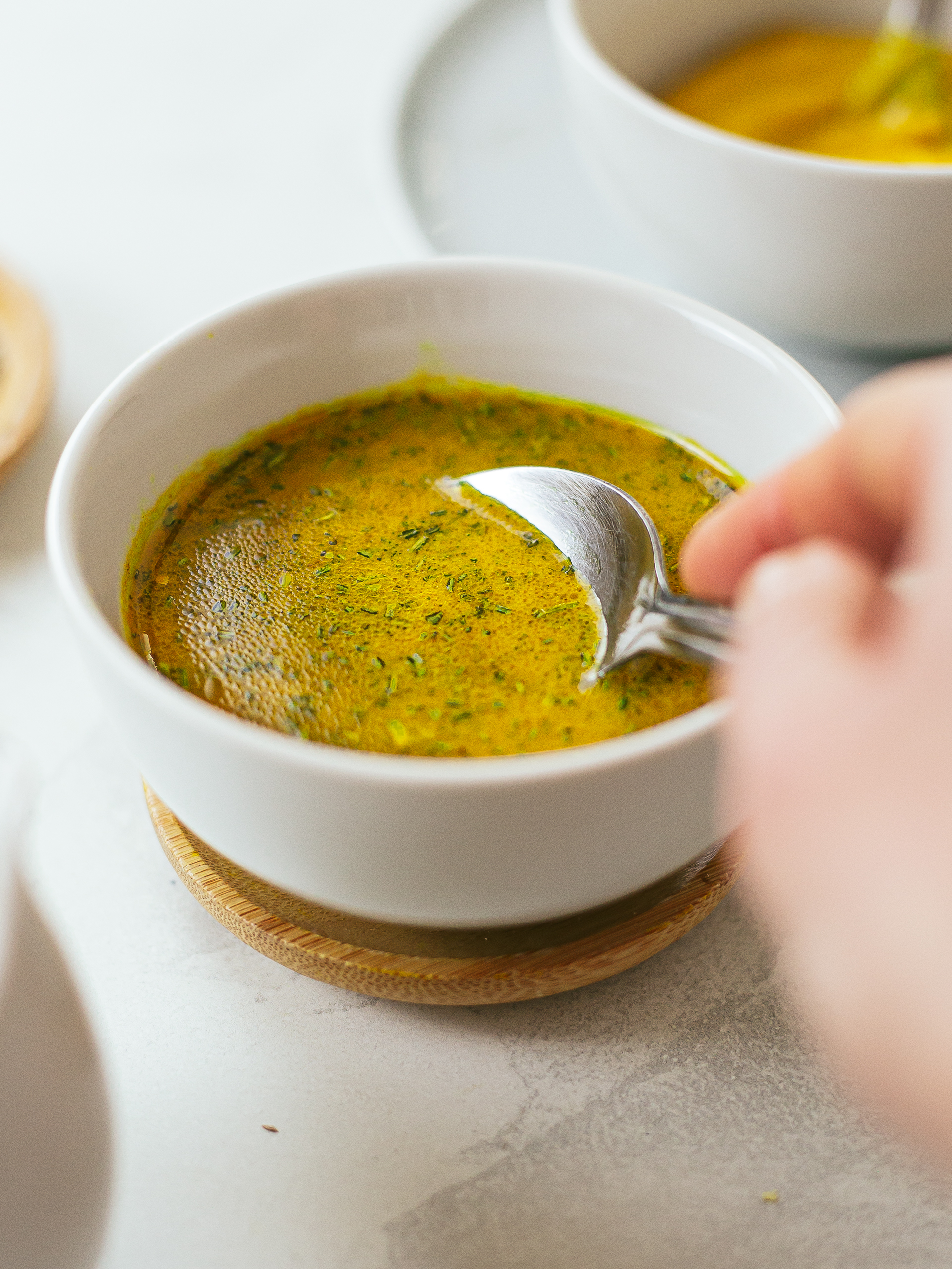 ginger turmeric rosemary dressing in a small bowl