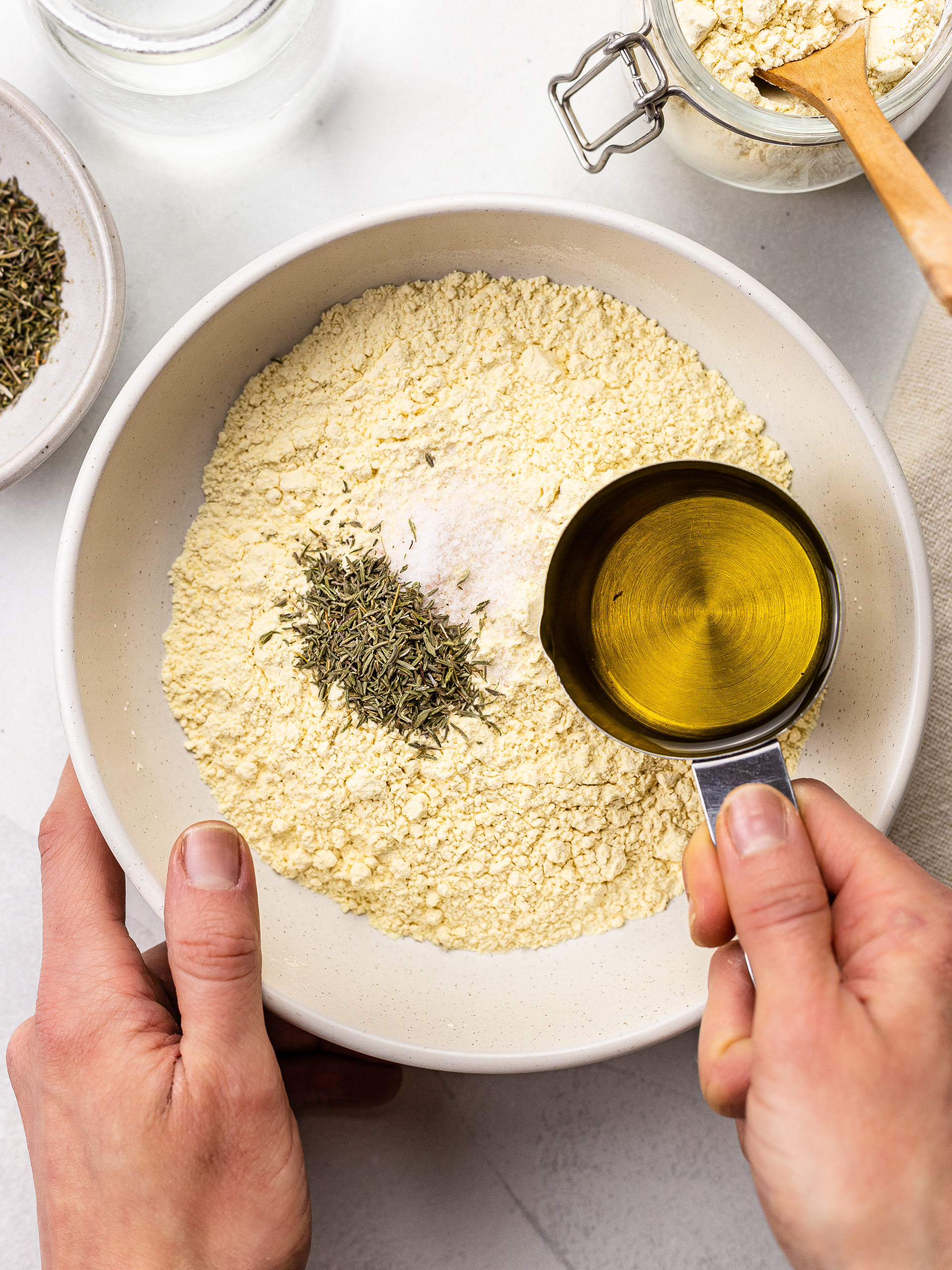 chickpea flour, oil, thyme and salt in a bowl for crackers