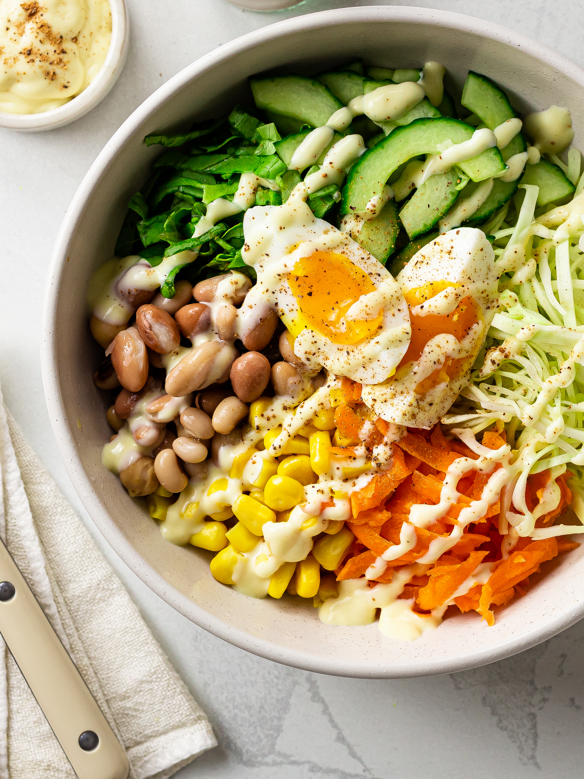 nigerian vegetable salad with eggs beans and cream dressing