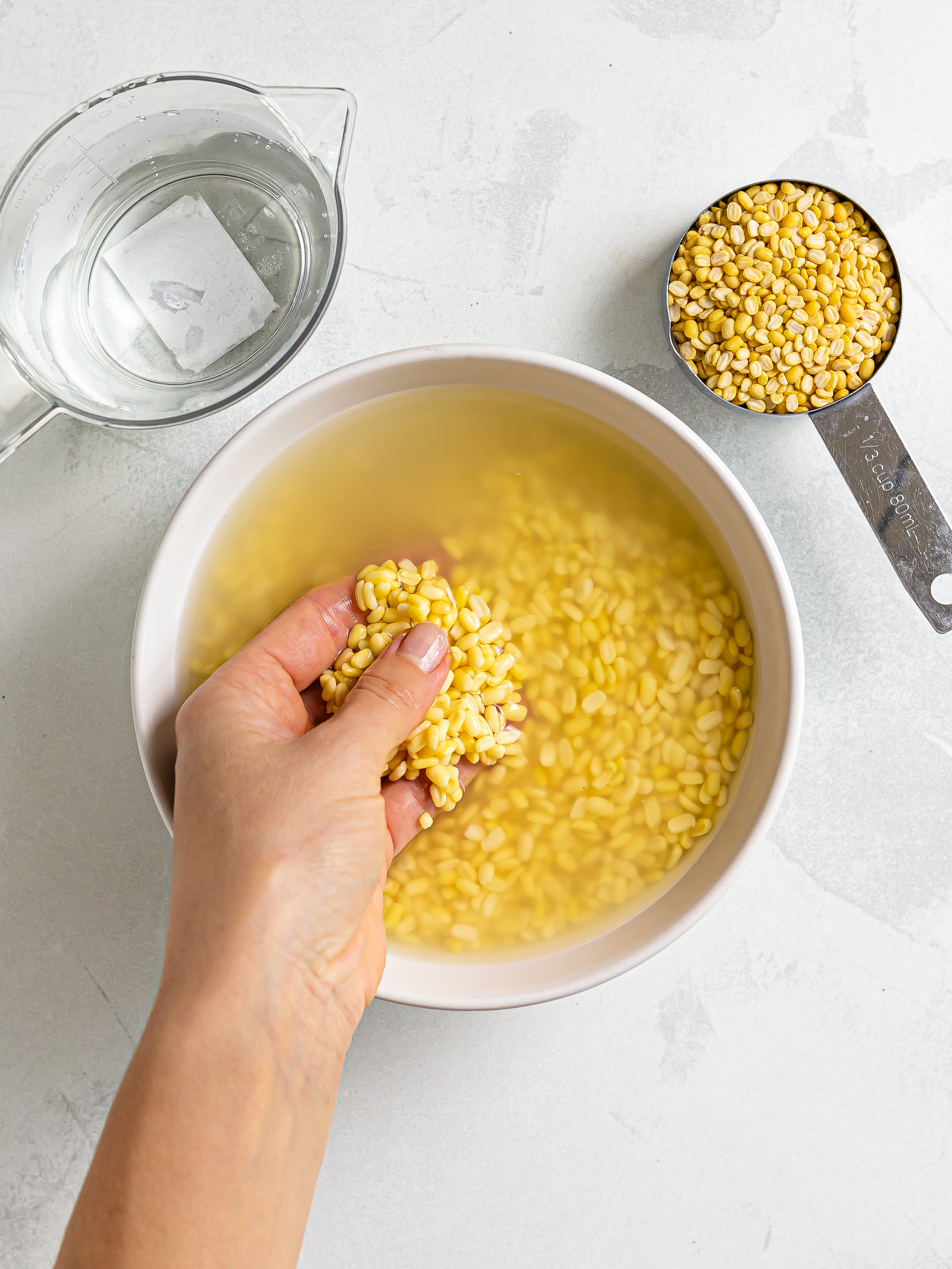 yellow split mung beans soaking in water