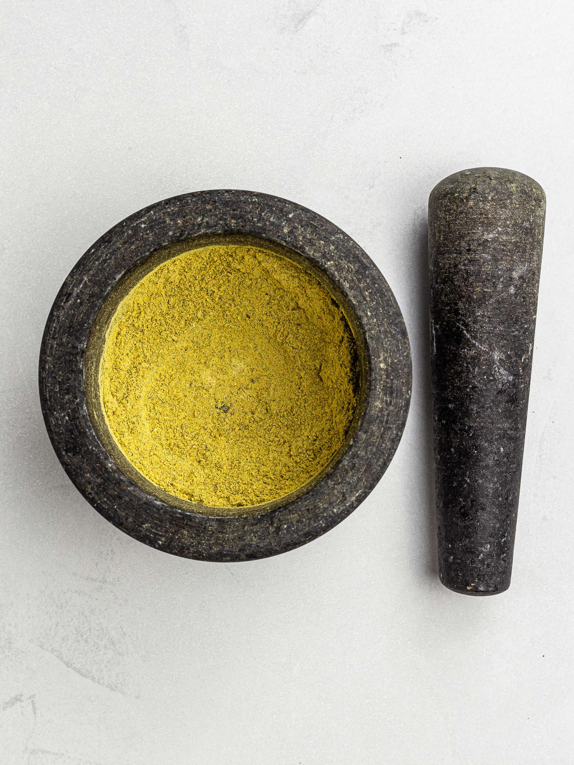 homemade bouillon powder in a mortar