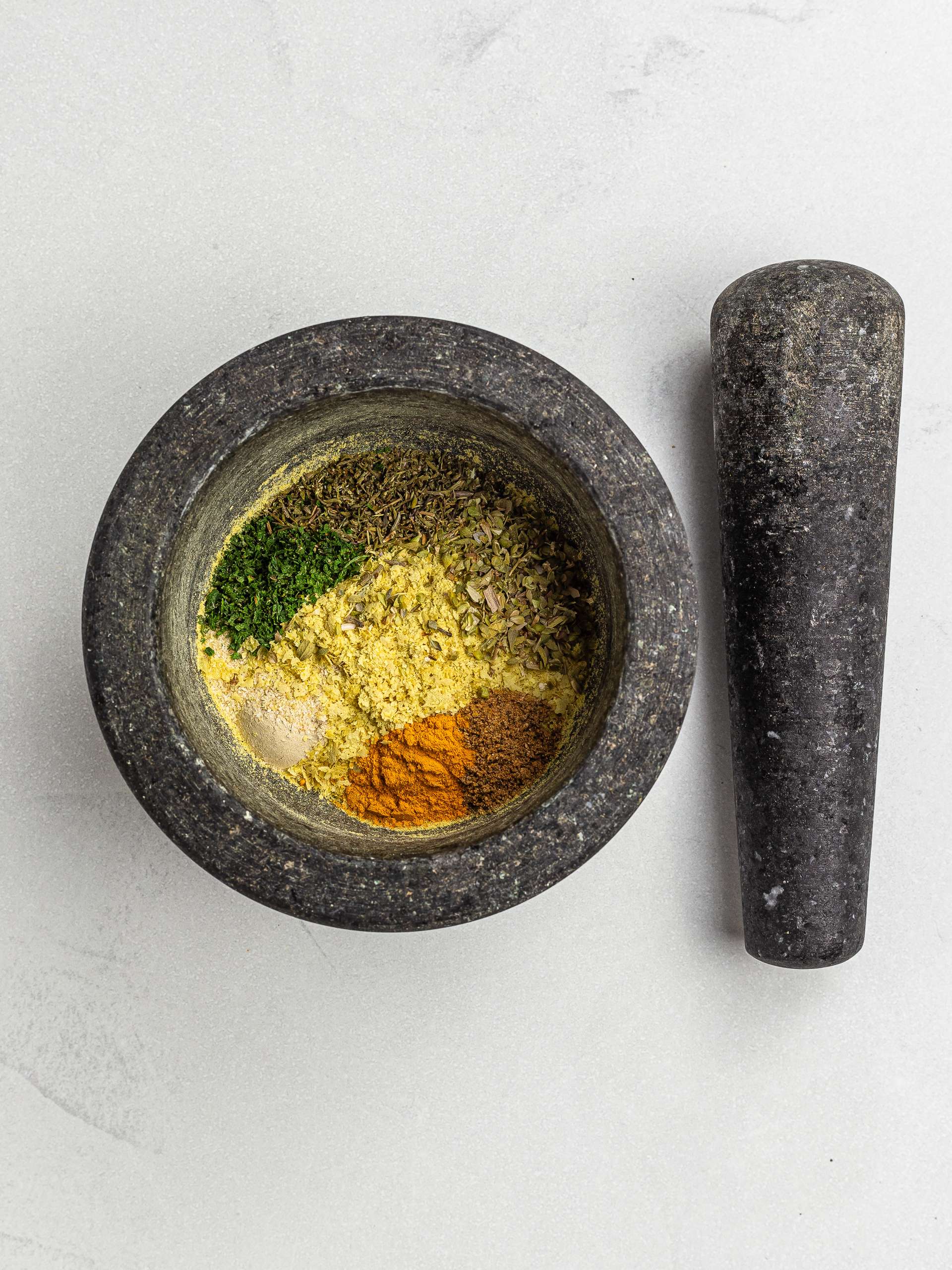 vegan bouillon power ingredients in a mortar