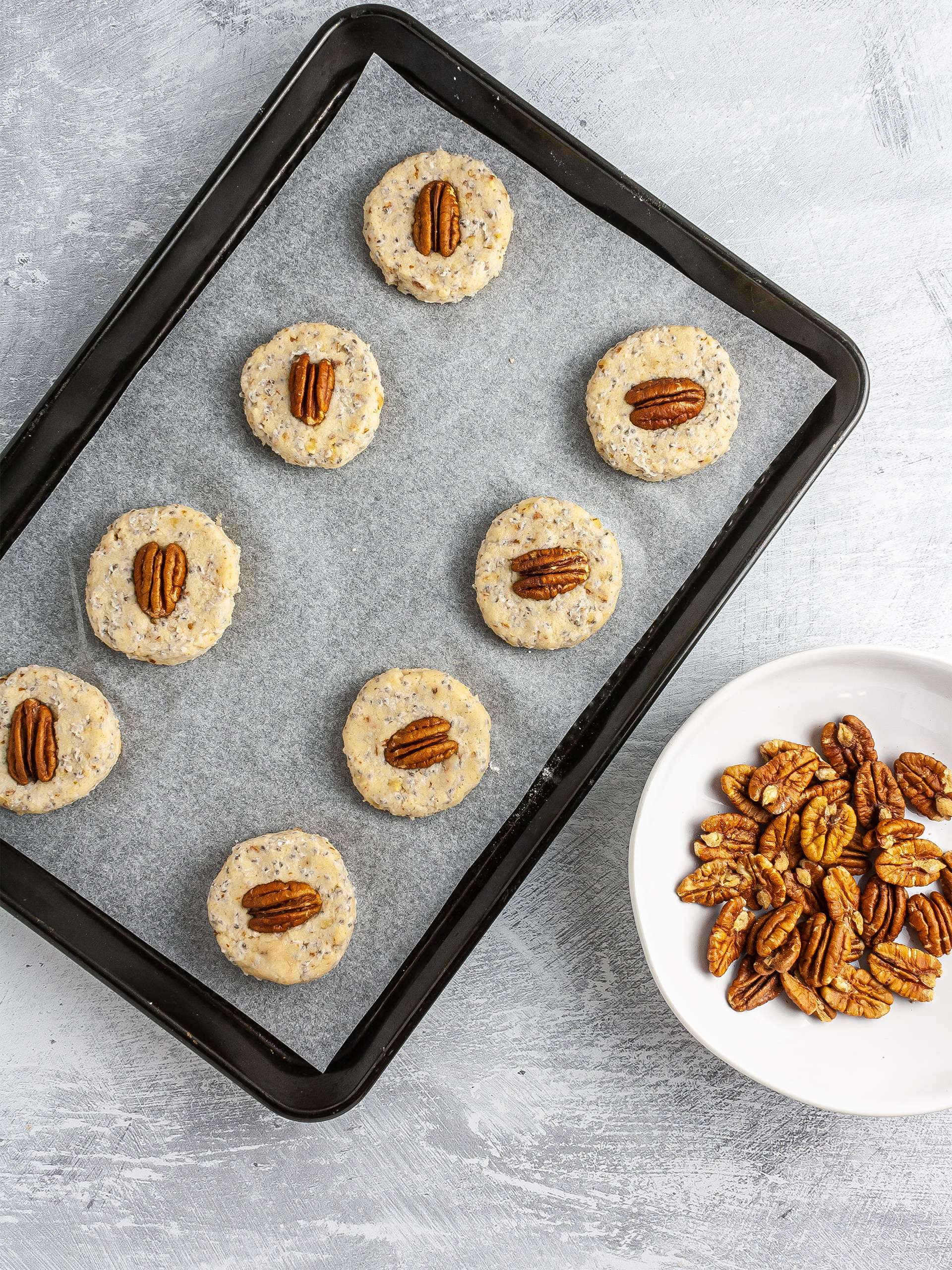 Shaped sandies topped with pecan nuts