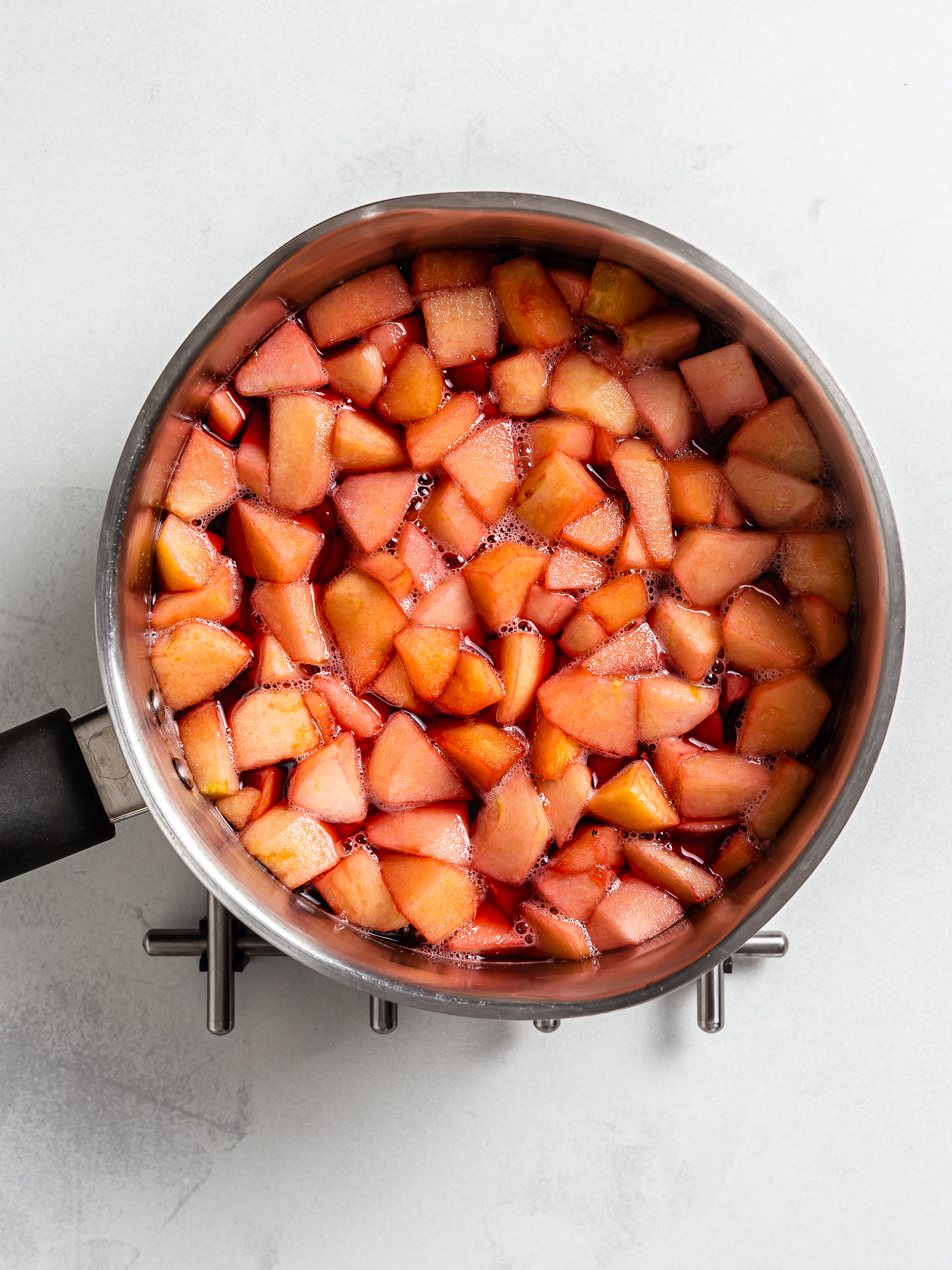 cooked apples with raspberries for jam