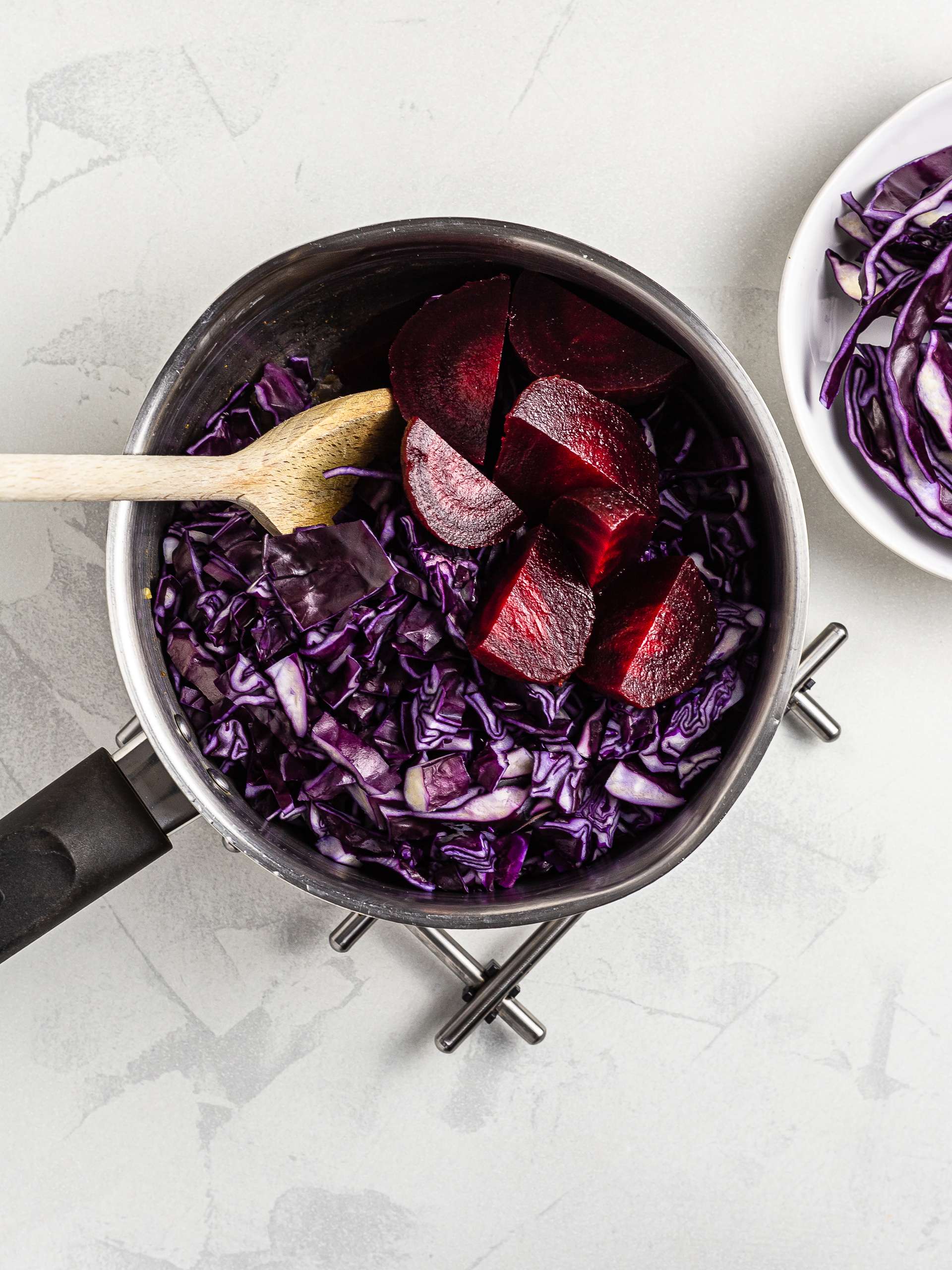 Red cabbage and beetroots in a pot for soup 