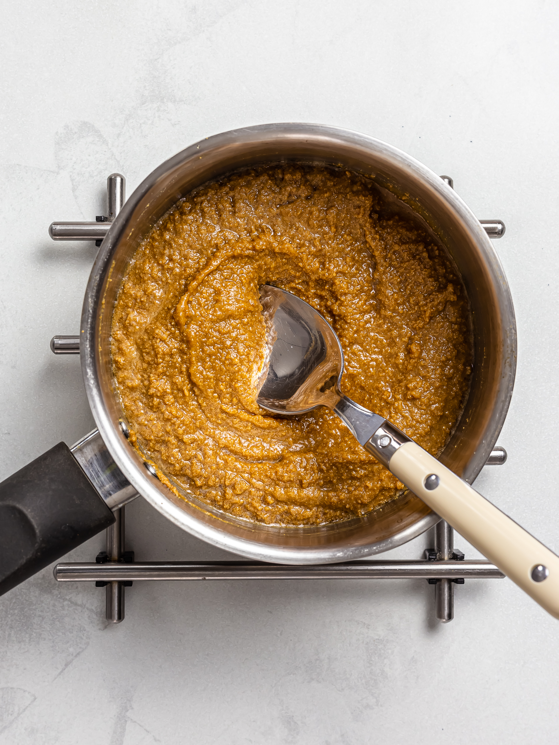 nut butter with maple syrup boiling in a pot