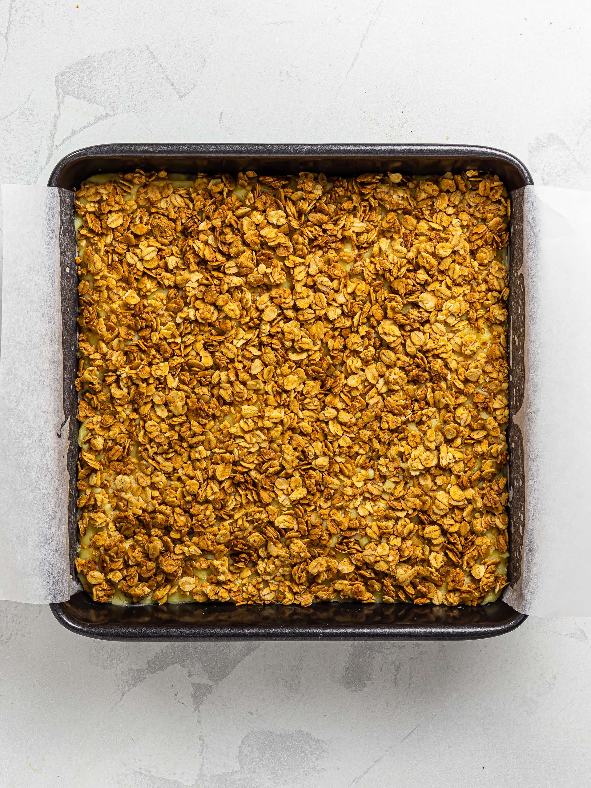 passion fruit curd filled bars topped with granola