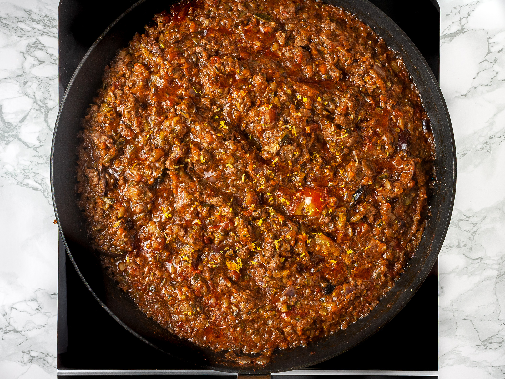 Lamb pie filling cooking in a skillet