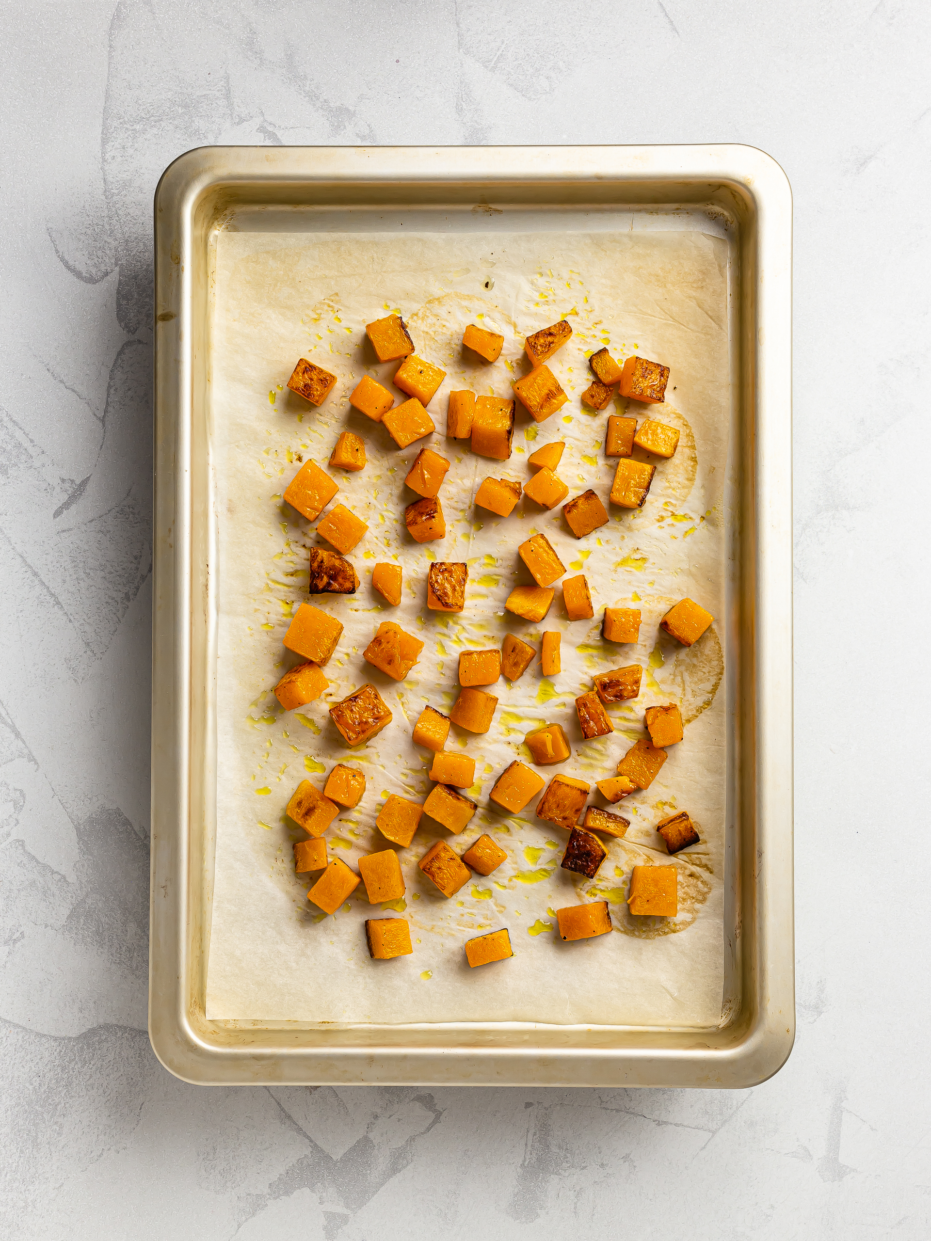 roasted pumpkin chunks on a tray