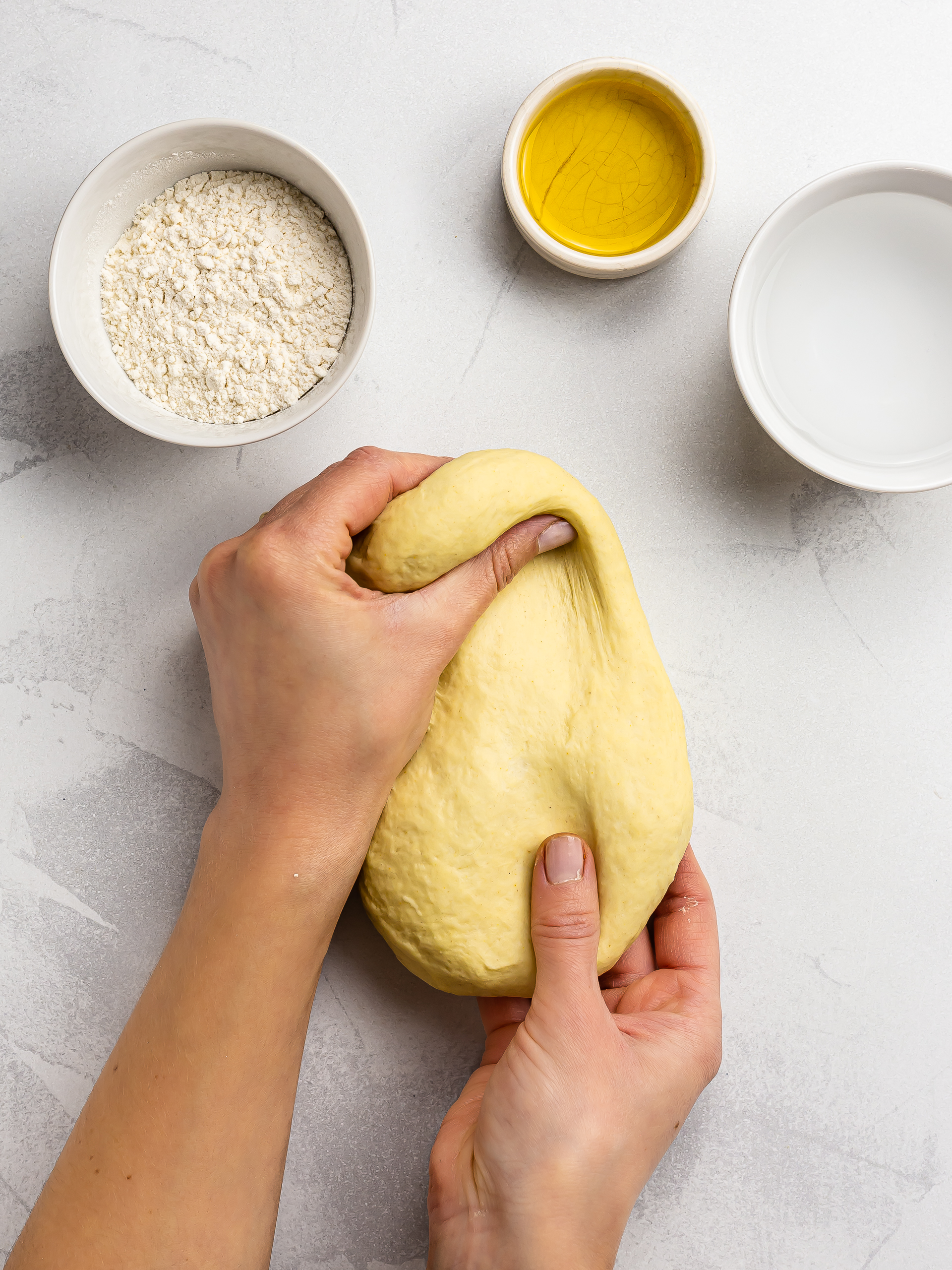 woman kneading egg-free pasta dough