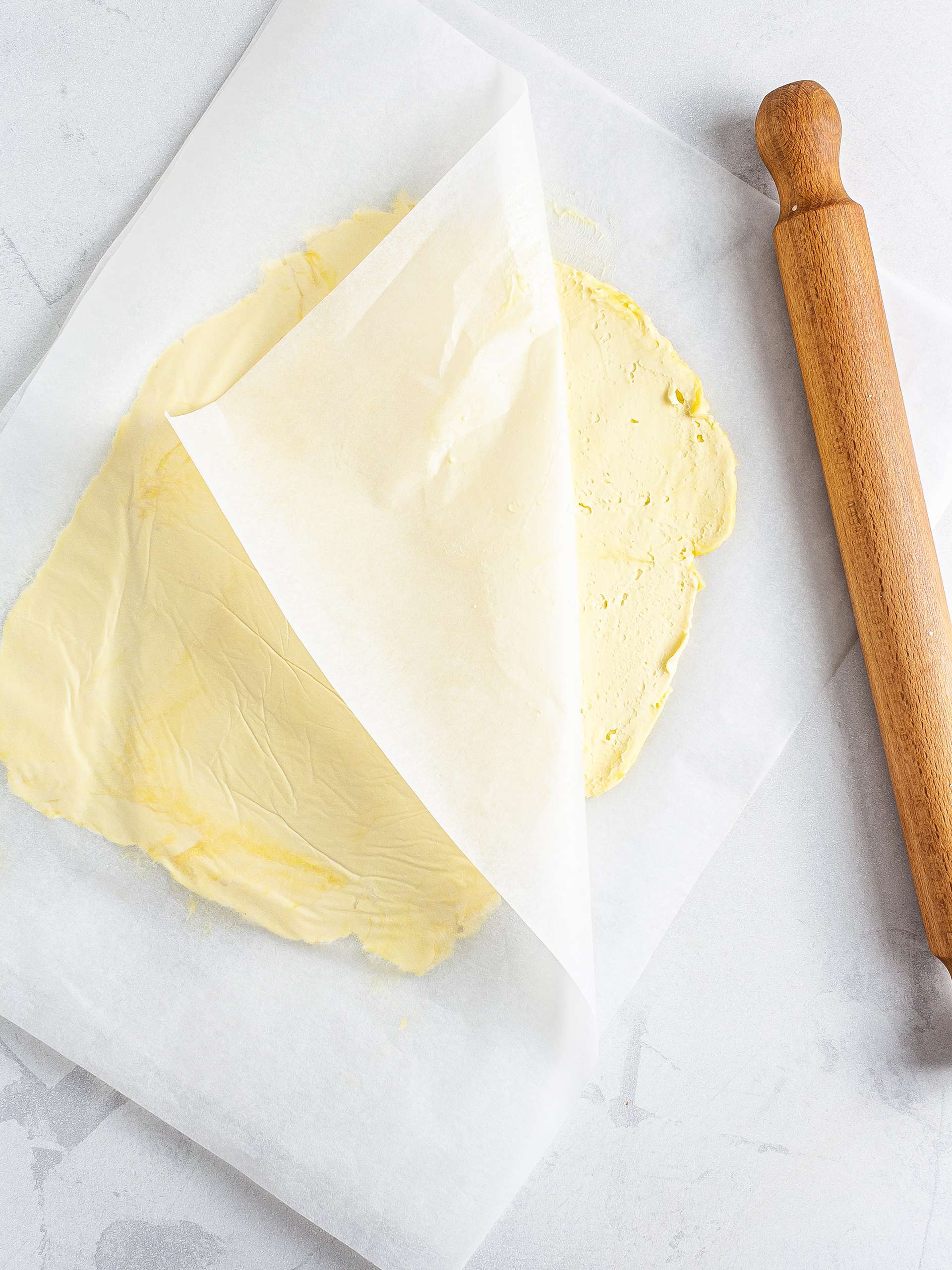 Vegan butter spread in between baking paper