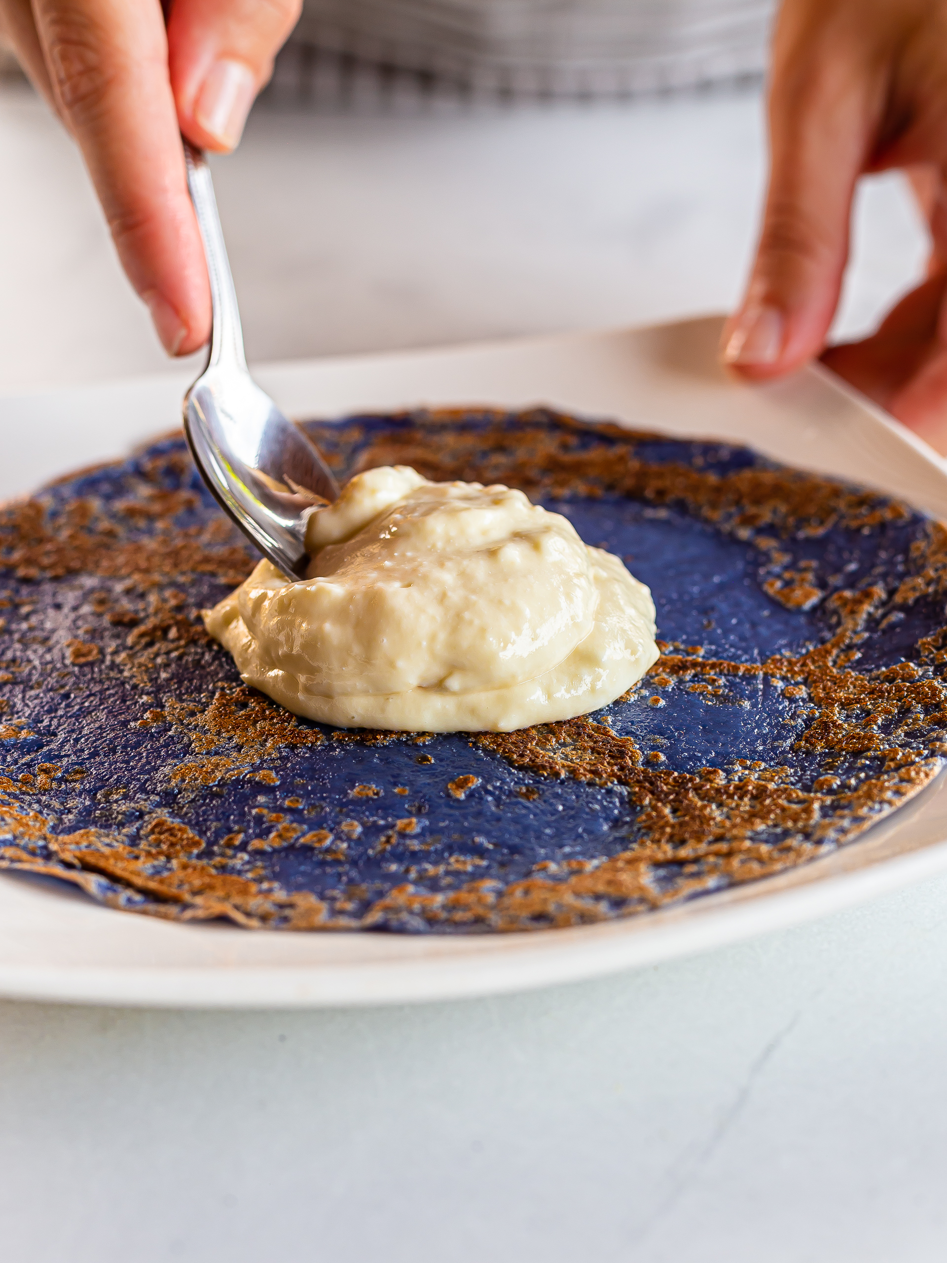 blue crepe topped with durian cream filling