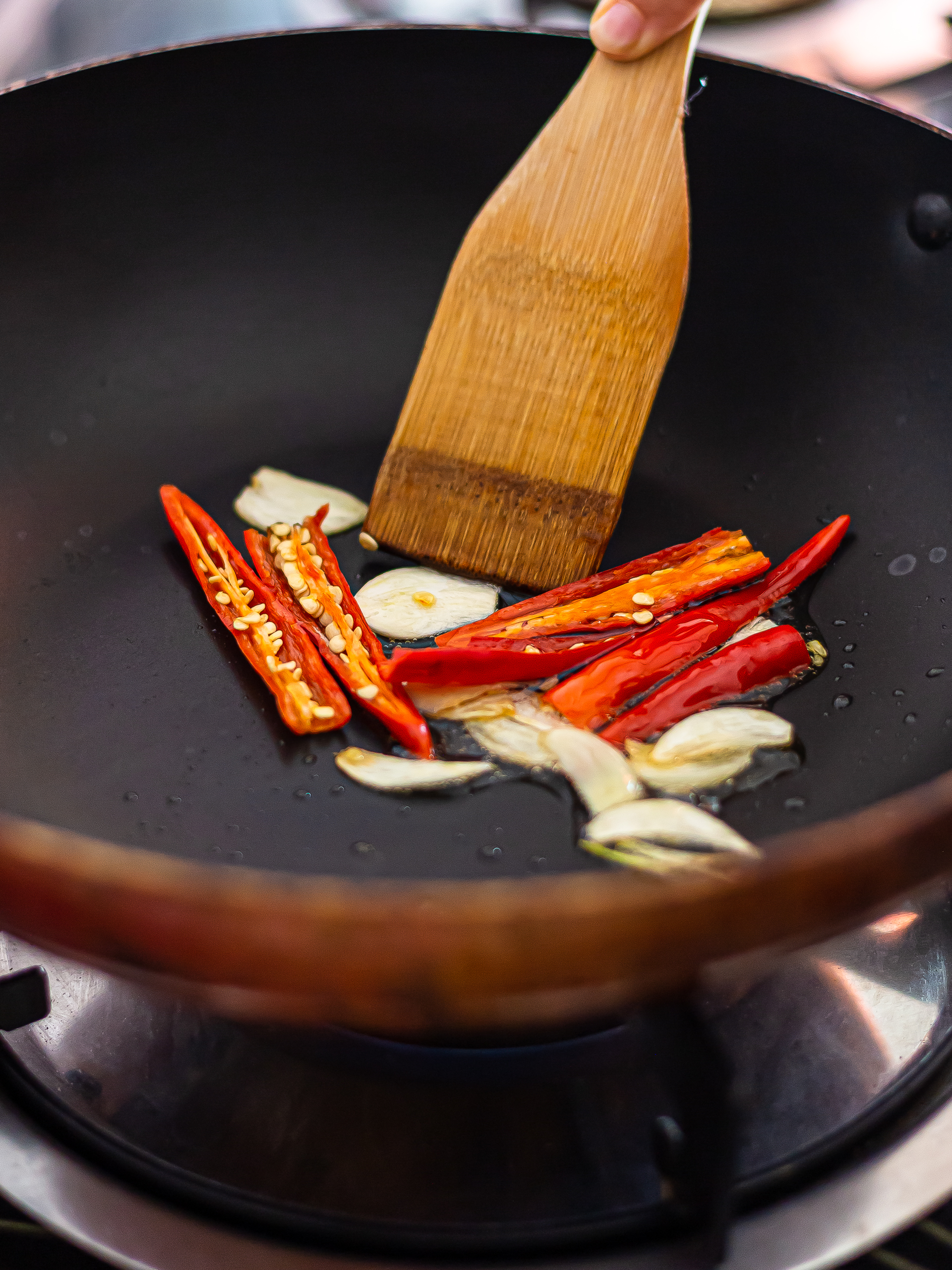 oil and garlic sizzling in a skillet