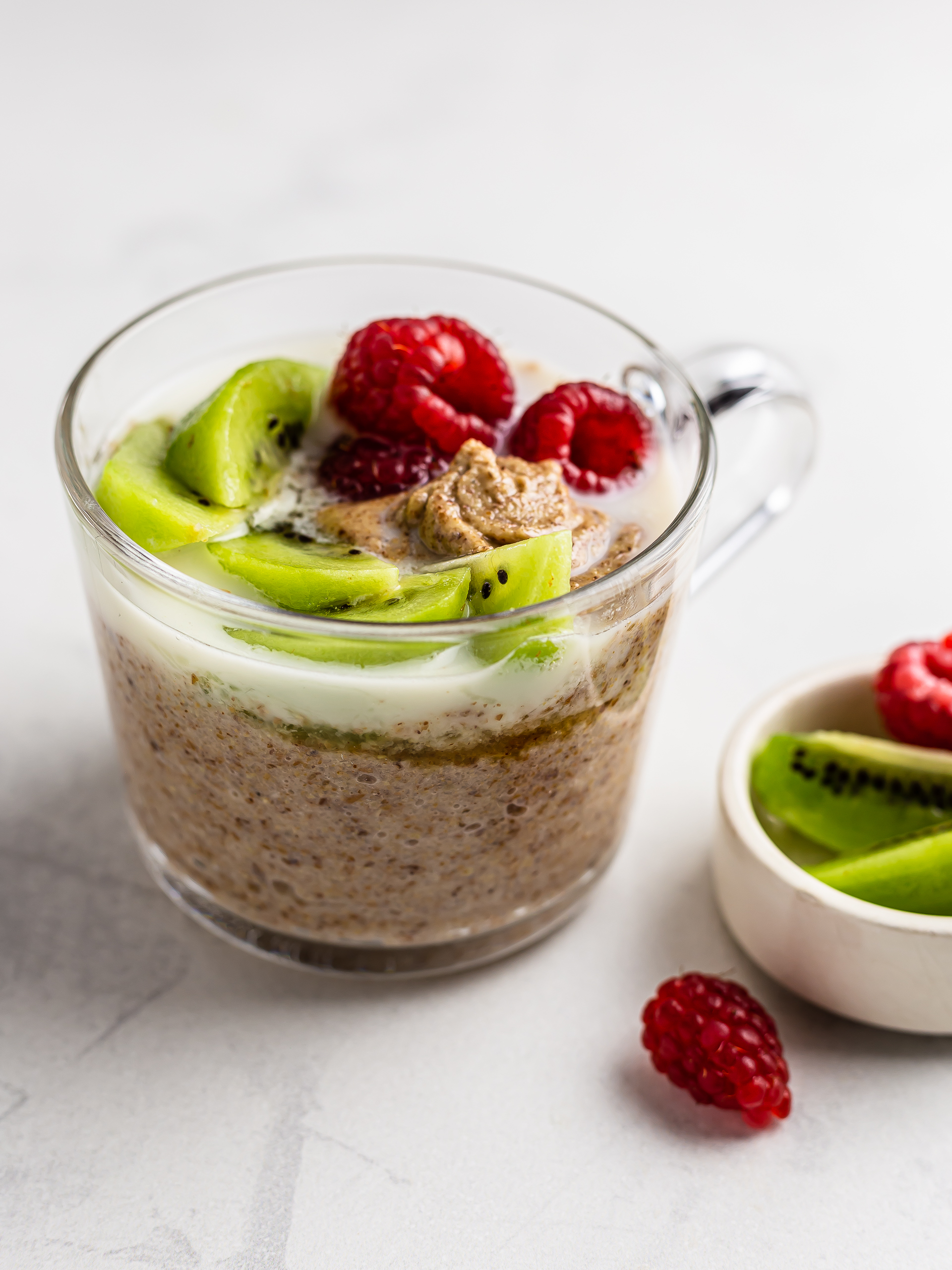 buckwheat porridge topped with raspberries and kiwi