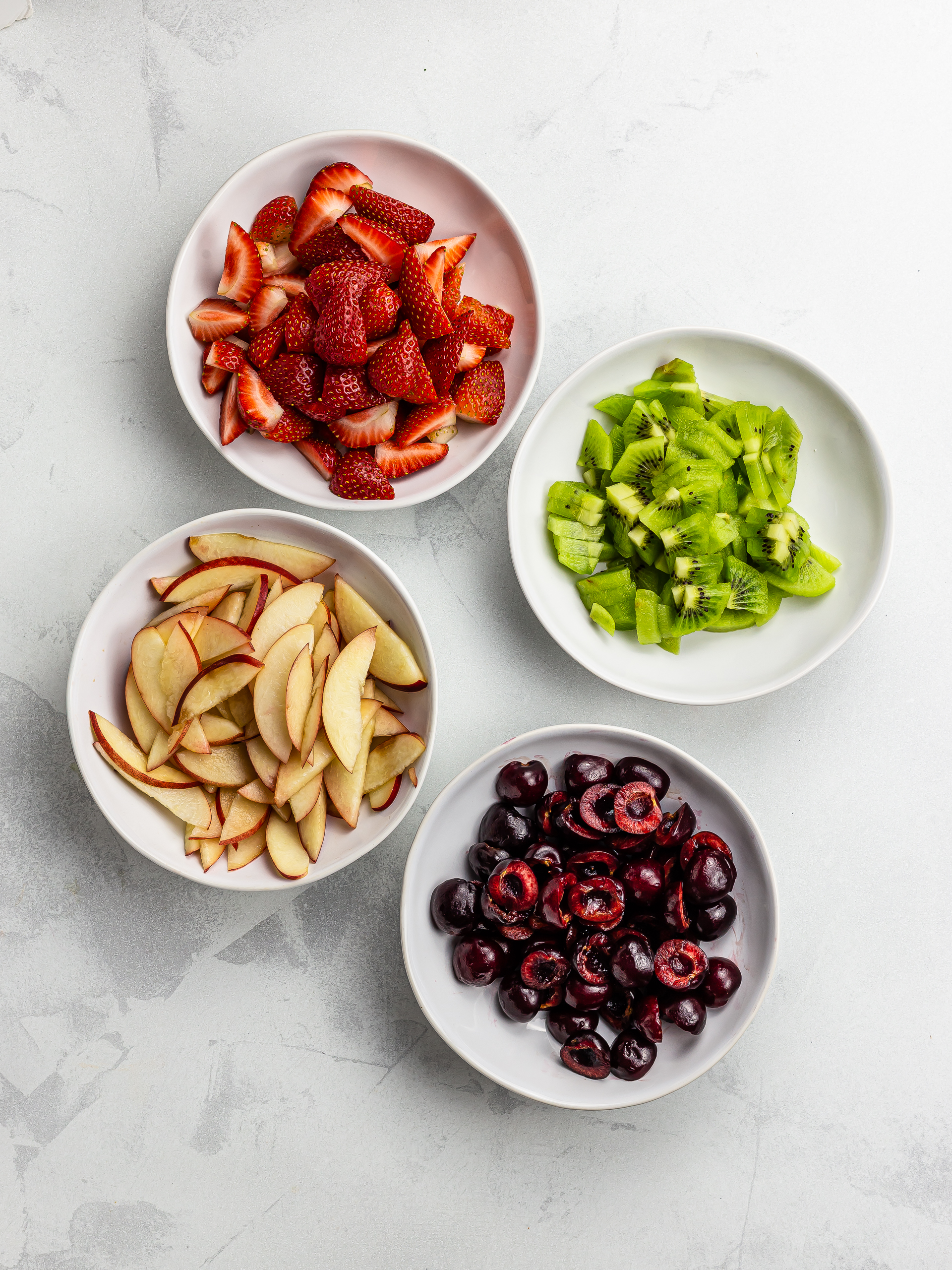 chopped summer fruit in a bowl