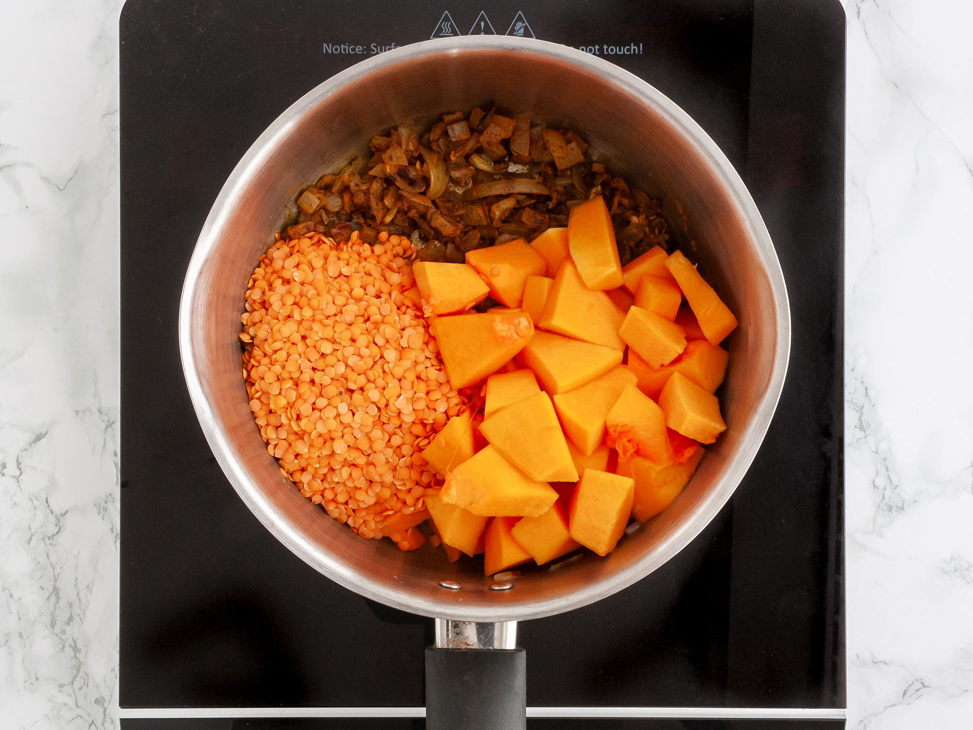 butternut squash soup ingredients in a pot