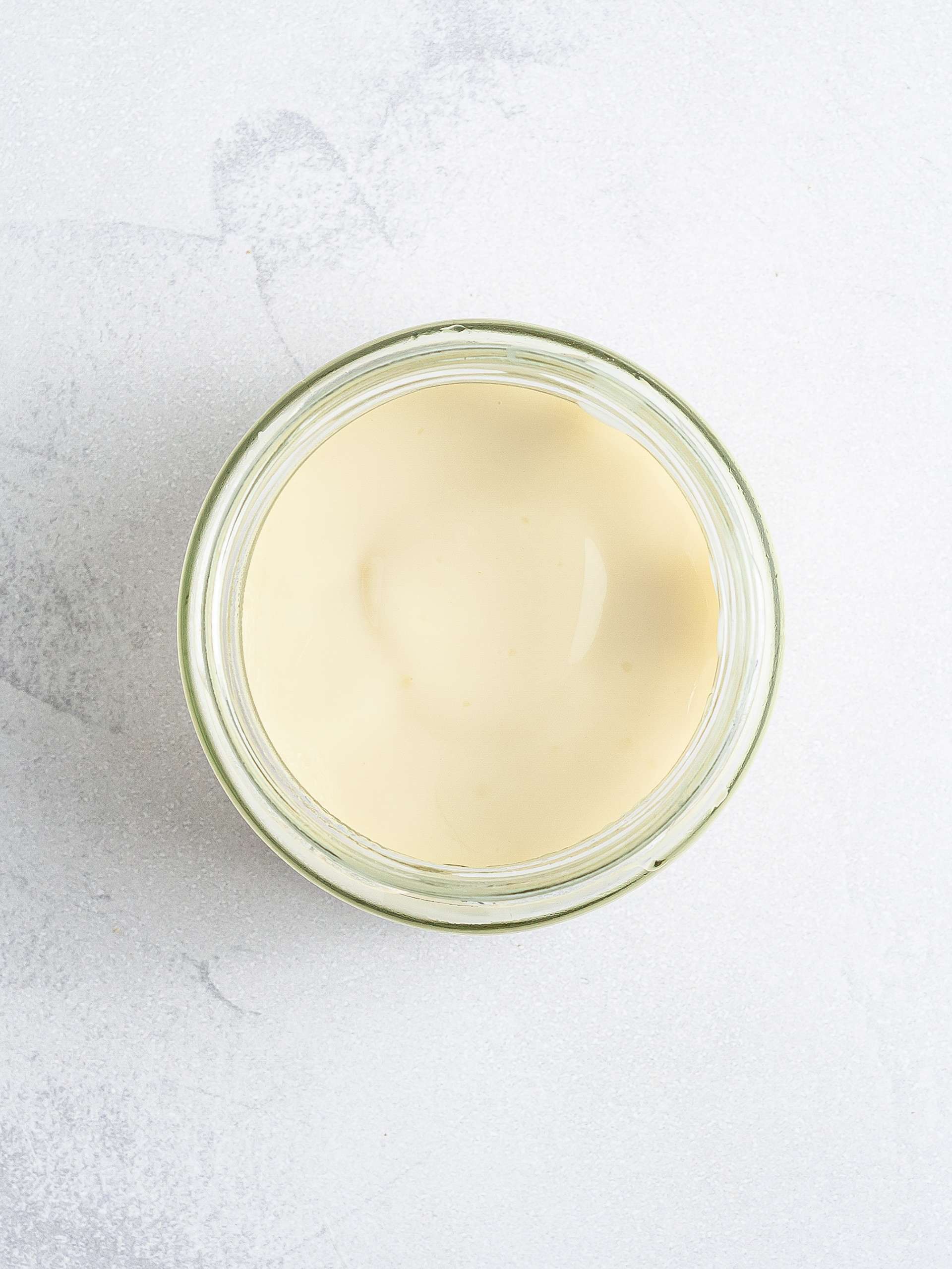 Thickened oat milk yogurt in a jar