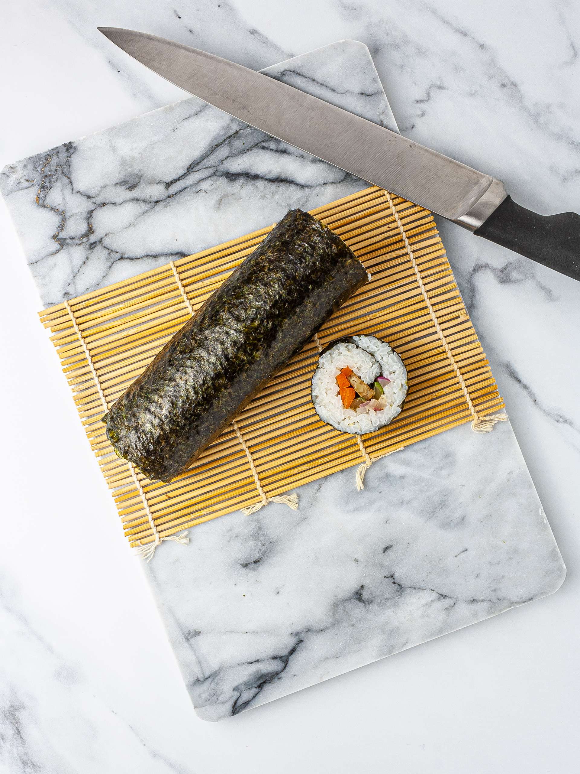 Vegan kimbap rolled and sliced.