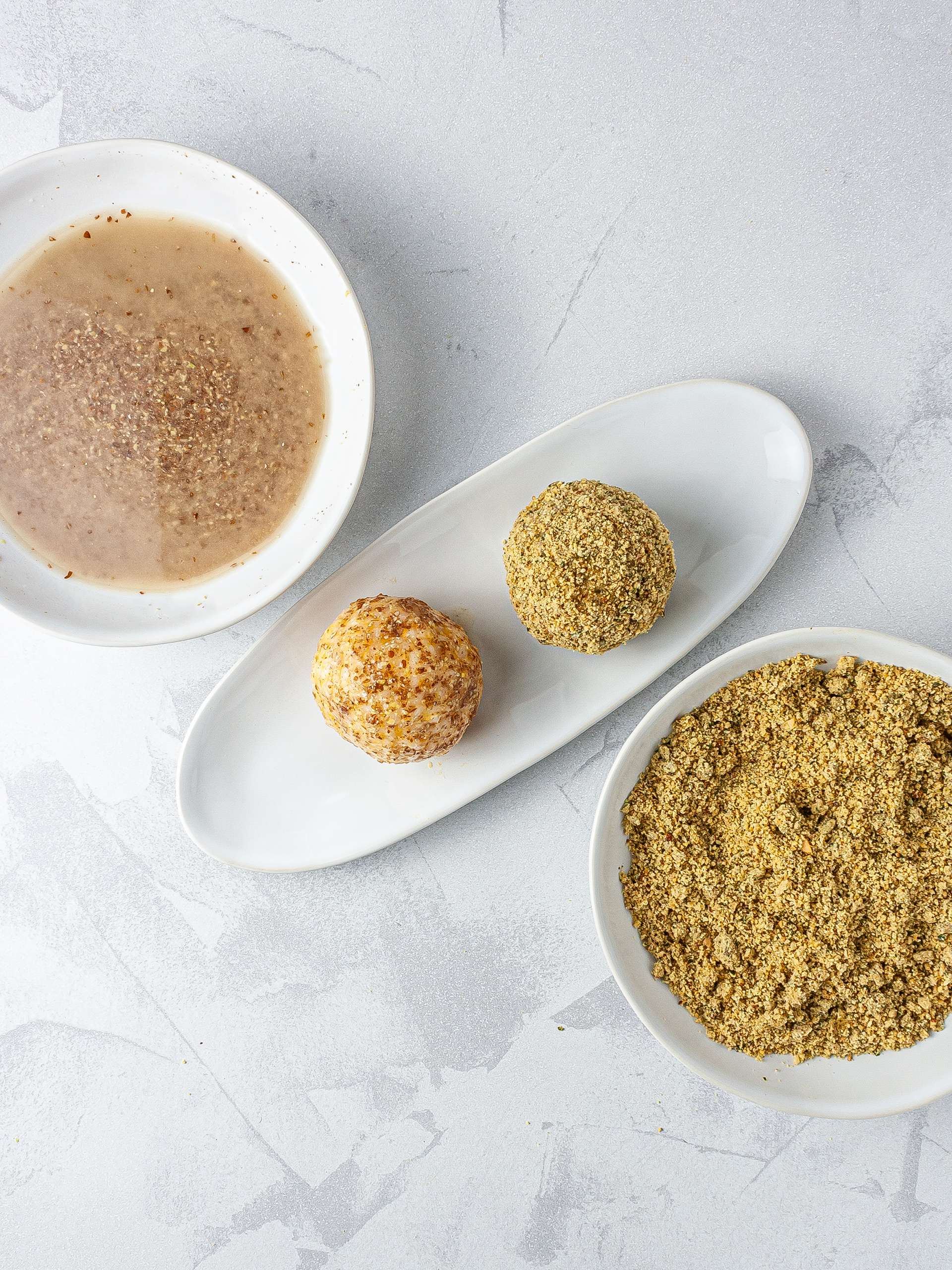 Rice balls coated in flax egg batter and then in gluten-free crumbs with nuts and seeds.