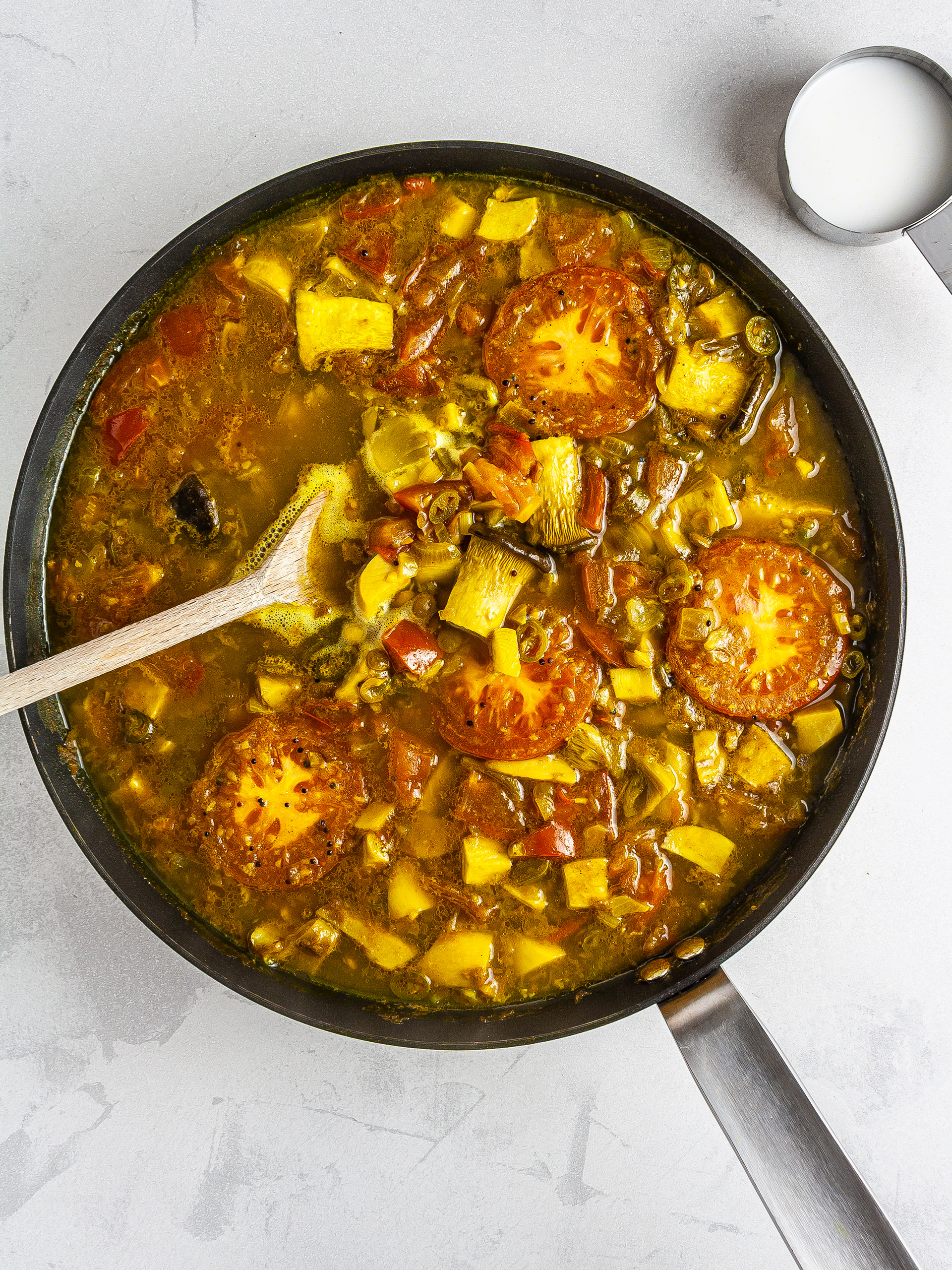 Mushrooms and tomatoes in coconut curry