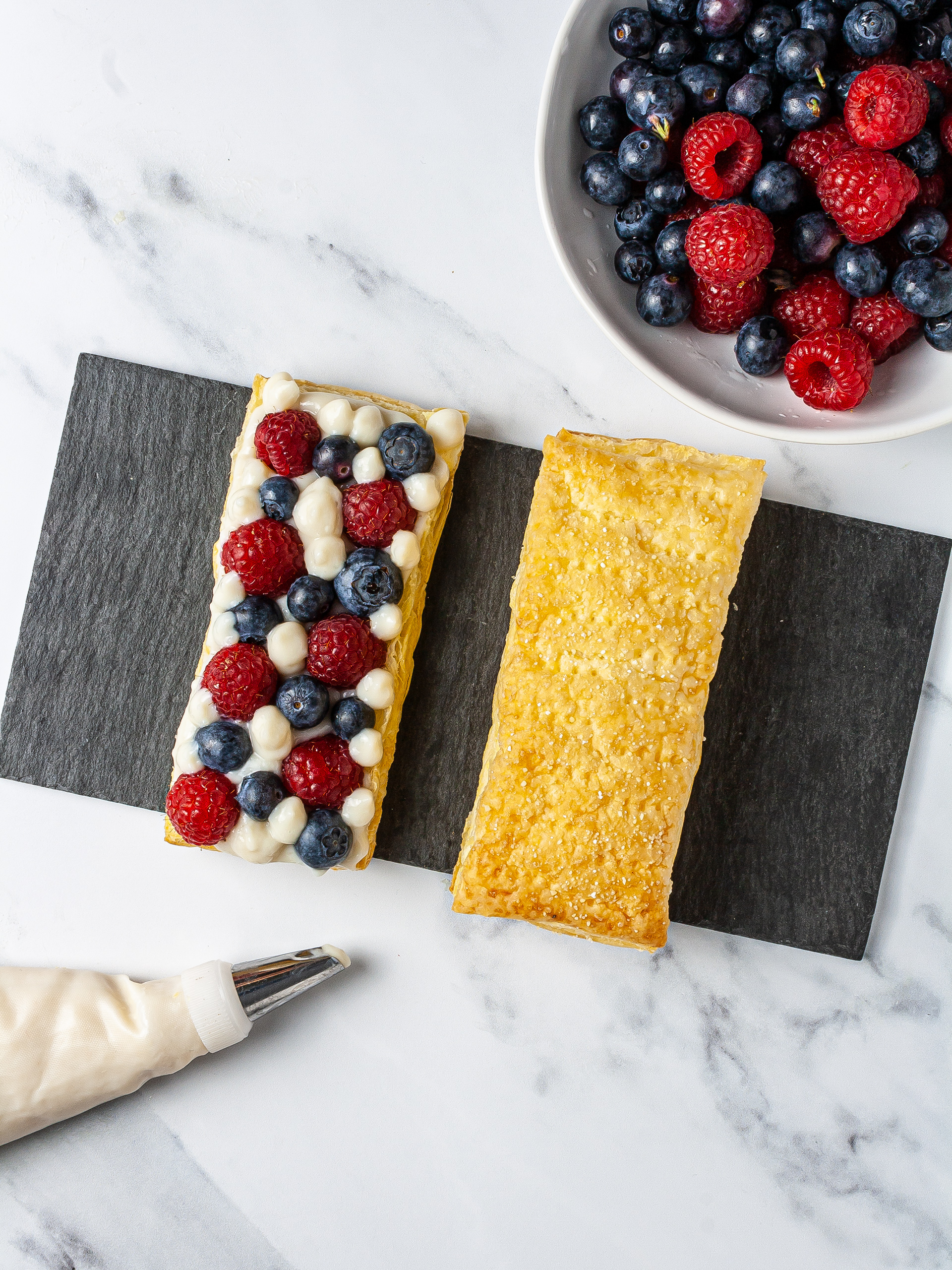 Puff pastry with almond cream, blueberries, and raspberries