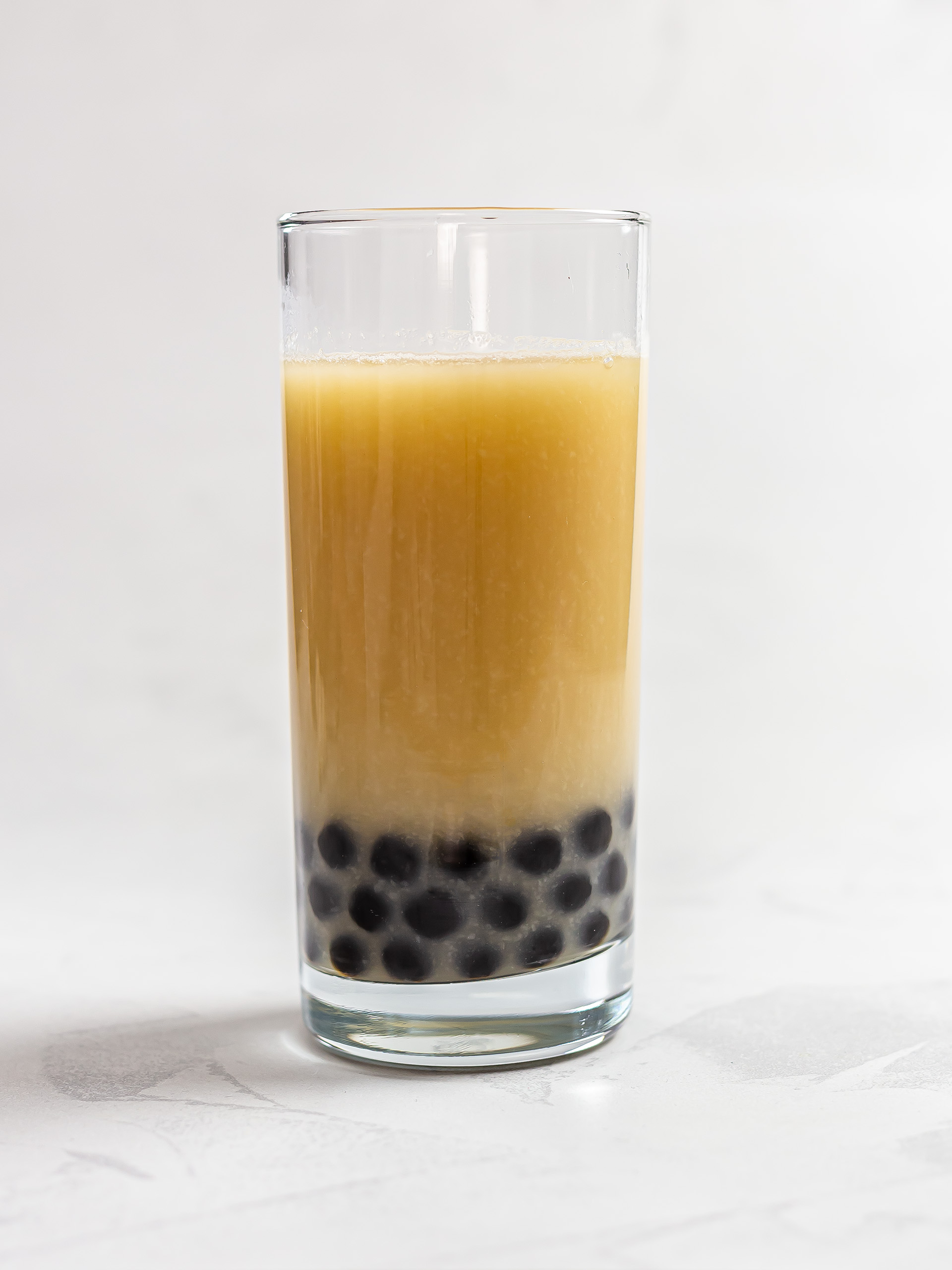 honeydew melon bubble tea in a glass