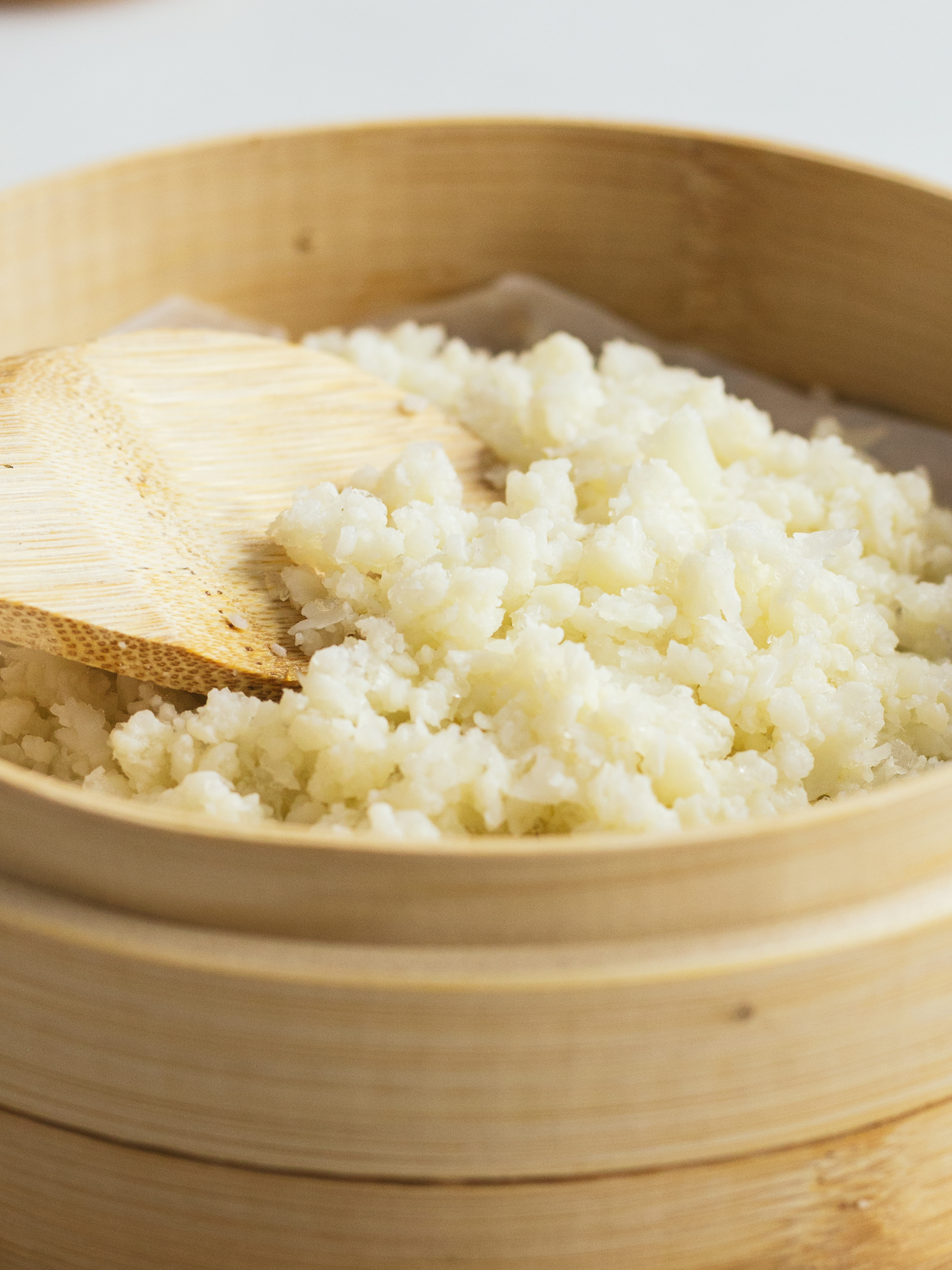 cauliflower rice for sushi in a bamboo steamer