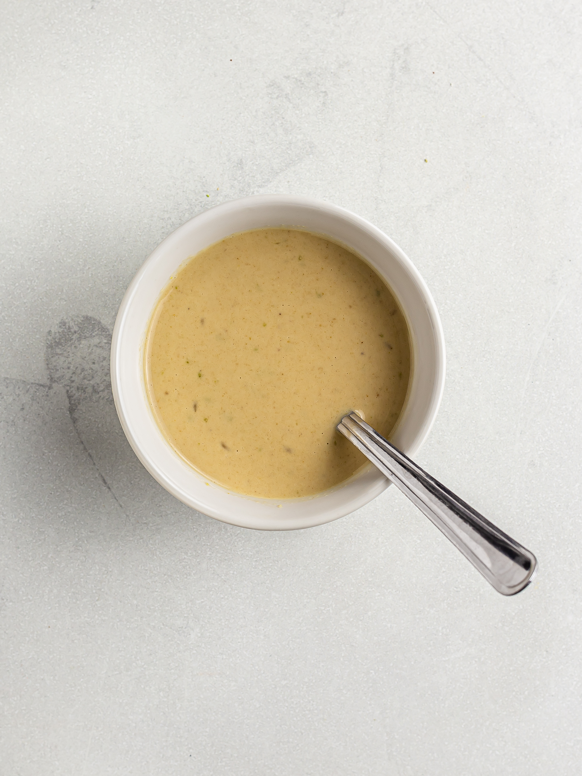 tahini lime dressing in a bowl