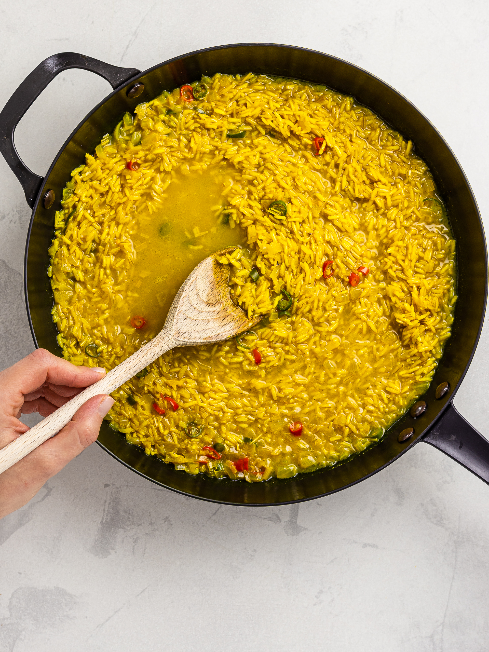 thai pilaf rice simmering with turmeric