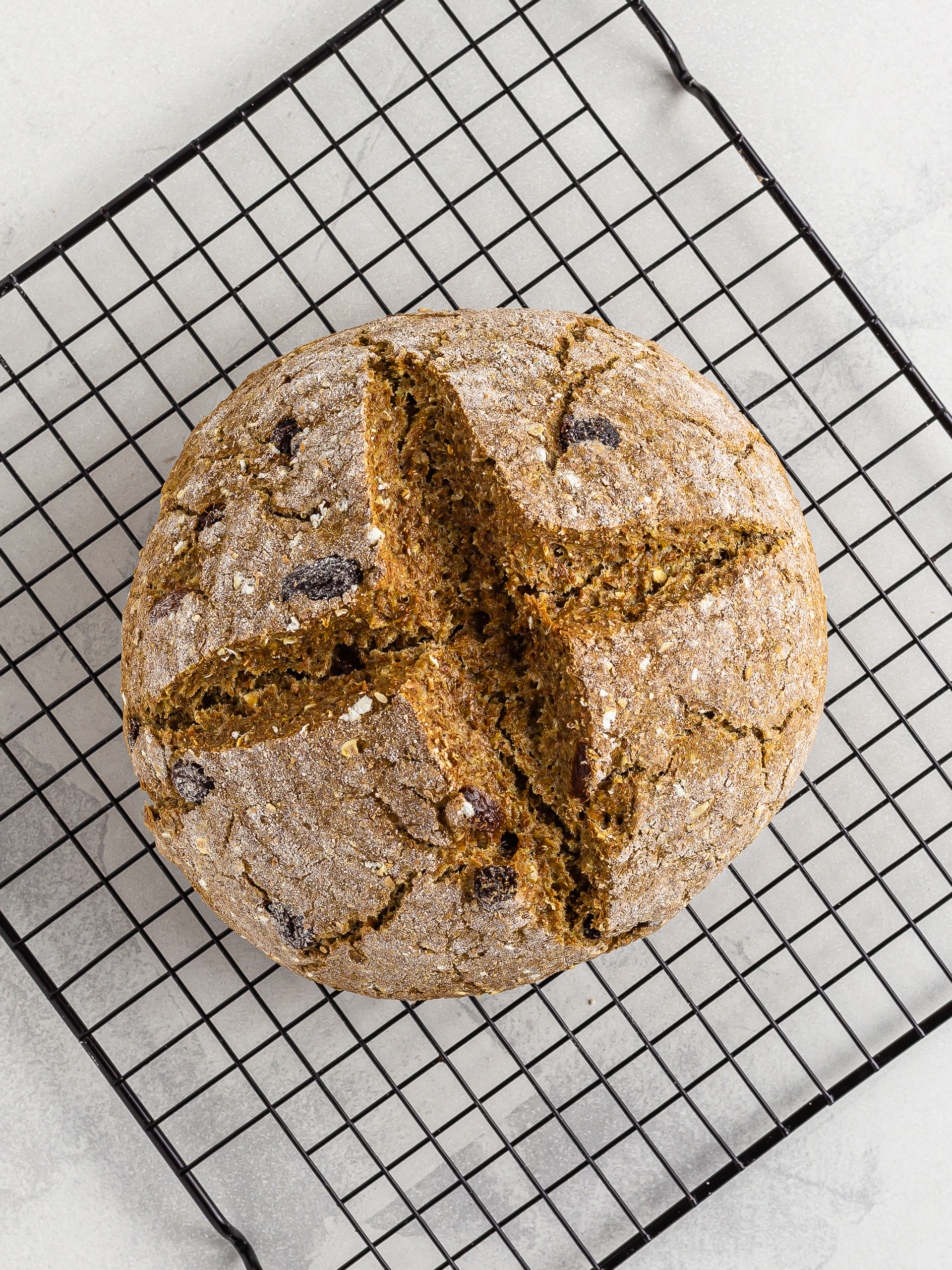 baked irish soda bread on a cooling rack