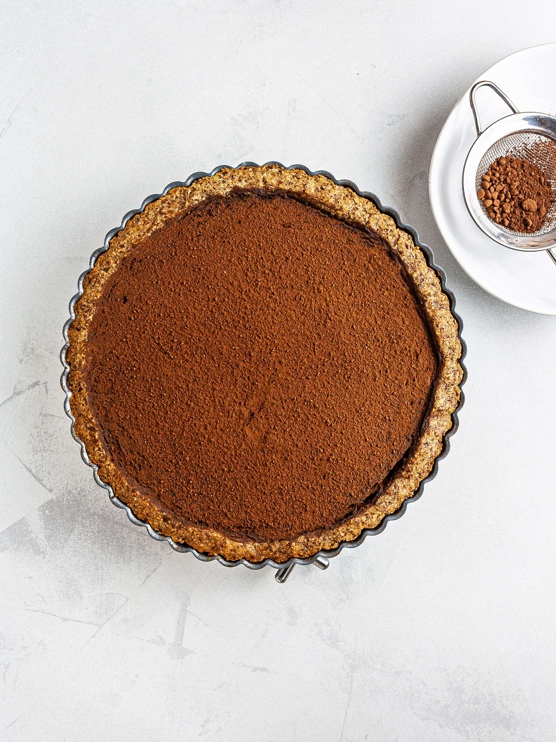 Baked chocolate pie dusted with cocoa powder