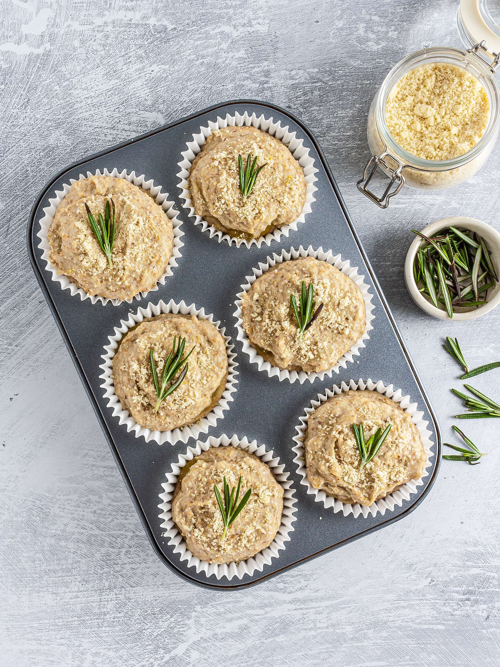 Muffins garnished with rosemary